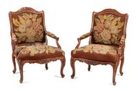 A Pair of Régence Style Carved Walnut Fauteuils
