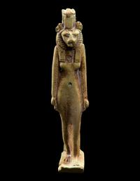 An Egyptian Faience Striding Sekhmet
