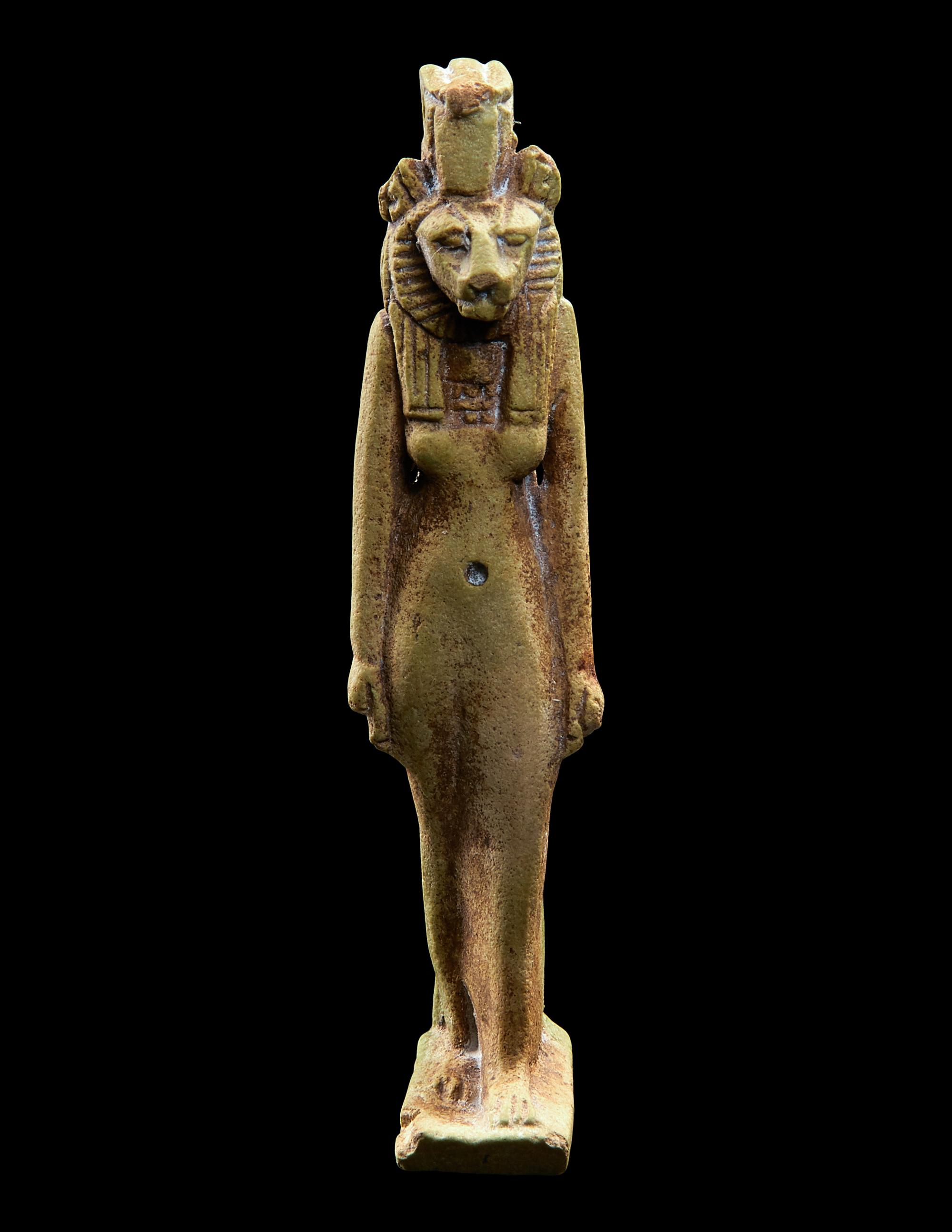 An Egyptian Faience Striding Sekhmet