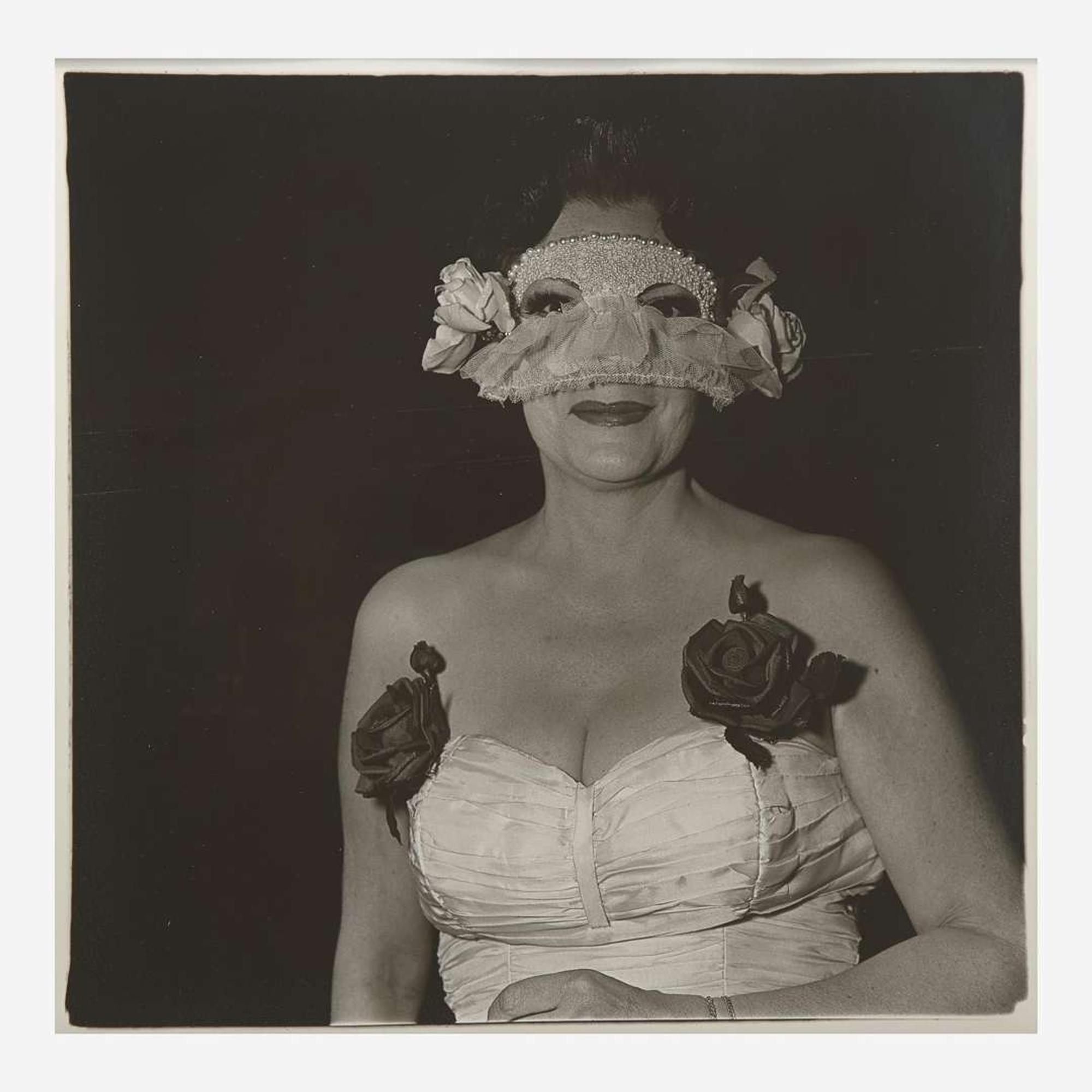 Diane Arbus (American, 1923-1971) Lady at a Masked Ball with Two Roses on her Dress, N.Y.C.