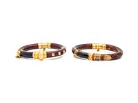 LA NOUVELLE BAGUE, PAIR OF STERLING SILVER, YELLOW GOLD-TOPPED SILVER AND ENAMEL BANGLE BRACELETS