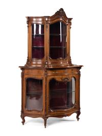 A Rococo Revival Carved Walnut Corner Vitrine Cabinet