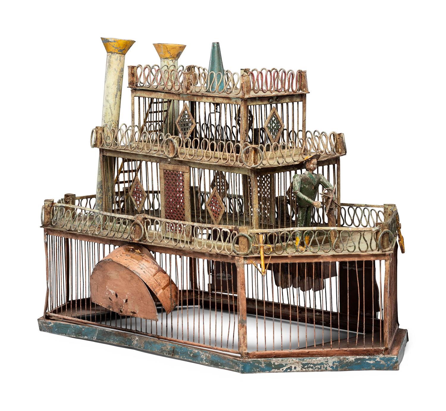 A Folk Art Cut and Painted Metal Paddleboat Form Birdcage
