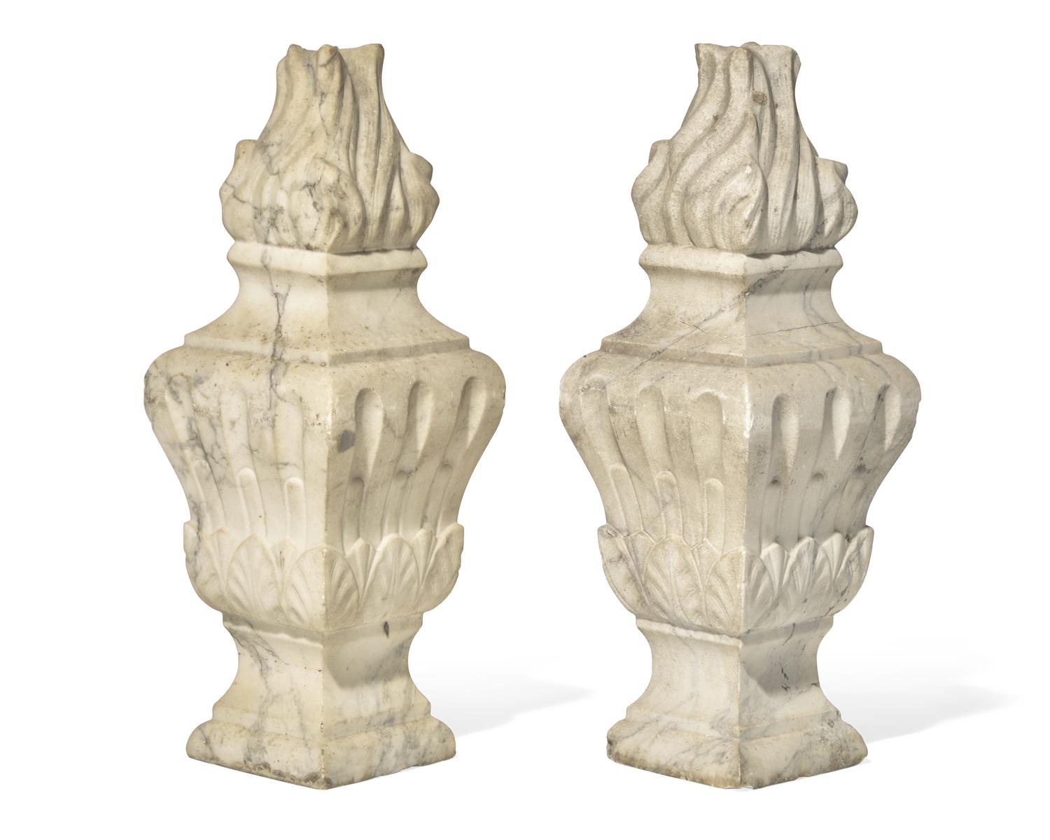 A pair of Italian carved white marble flame finials, 17th / 18th century