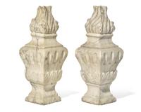 A pair of Italian carved white marble flame finials, 17th / 18th century