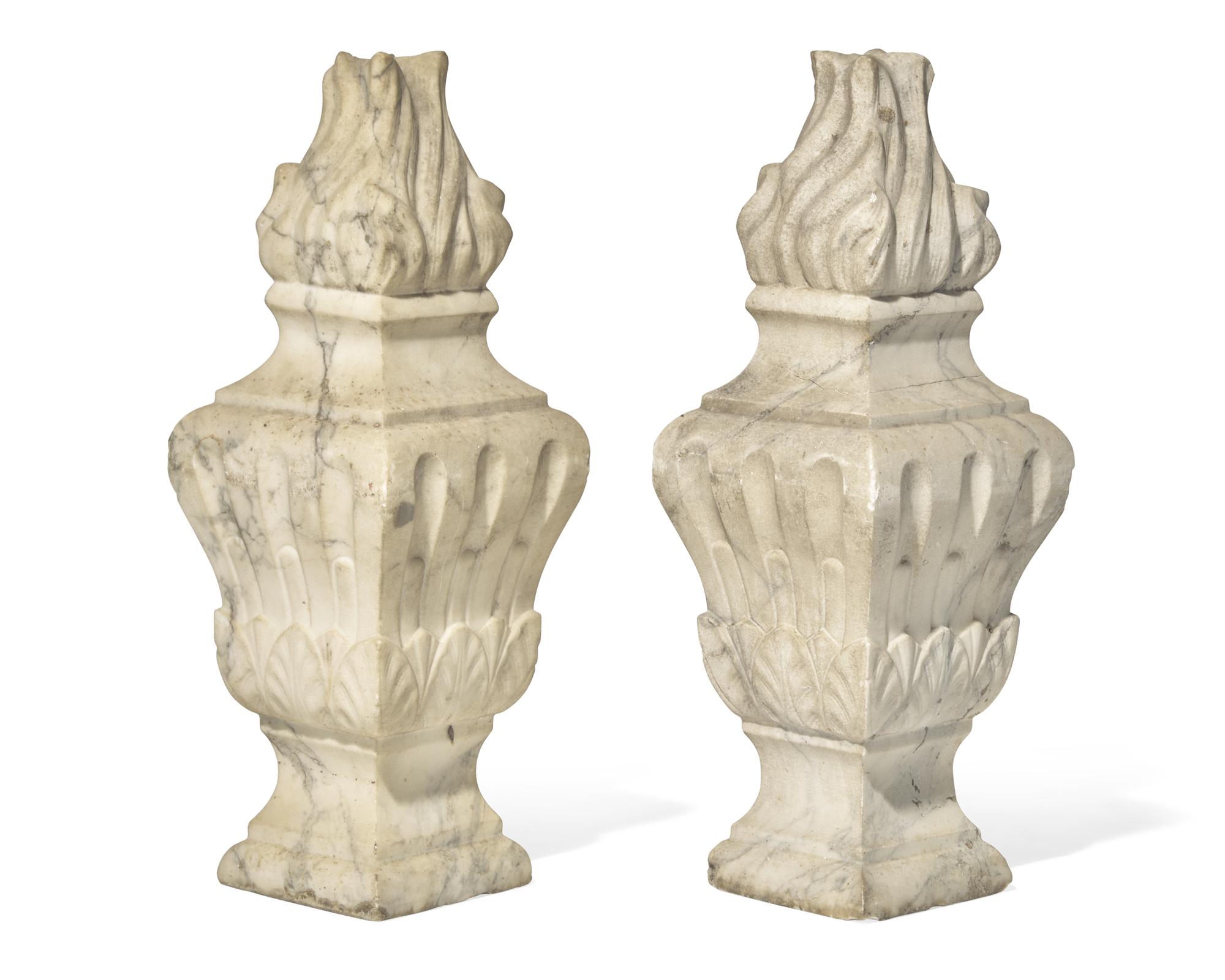 A pair of Italian carved white marble flame finials, 17th / 18th century