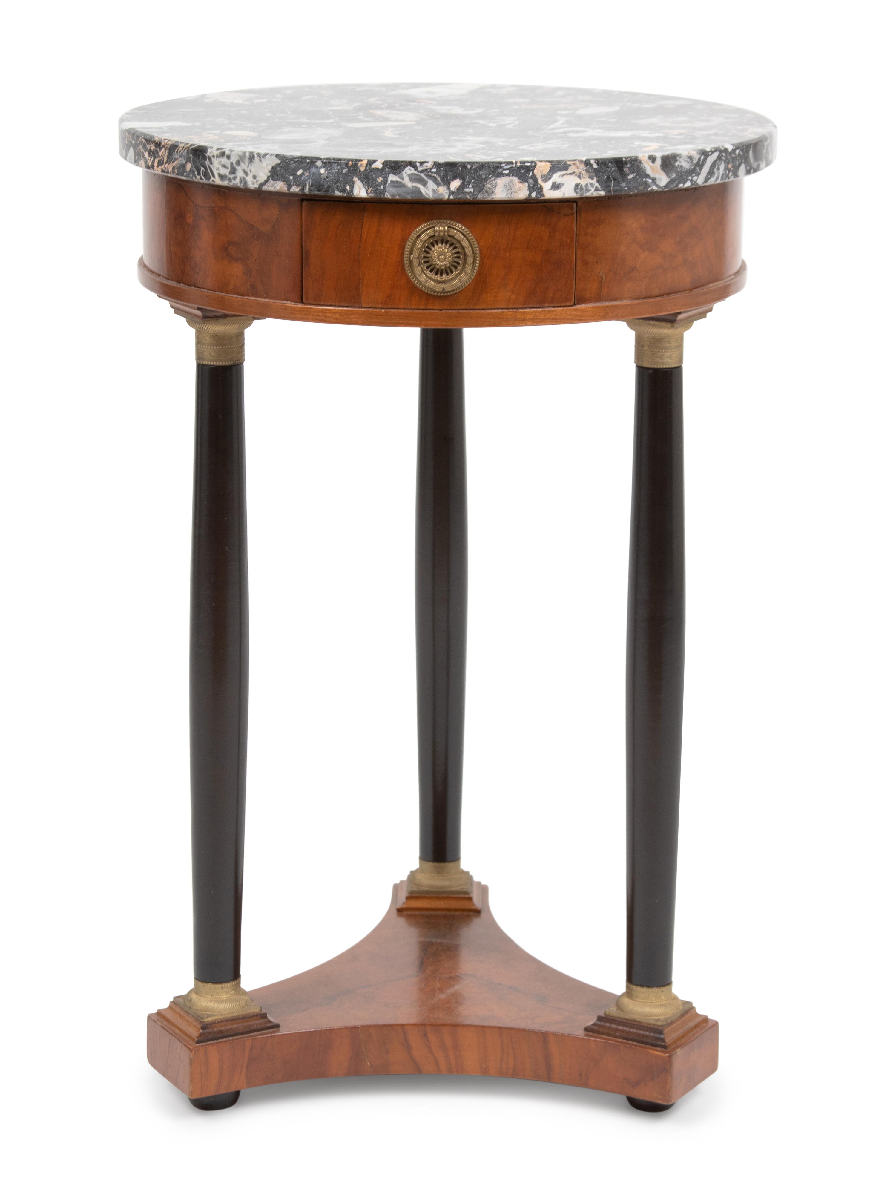 An Empire Style Part Ebonized Walnut Guéridon