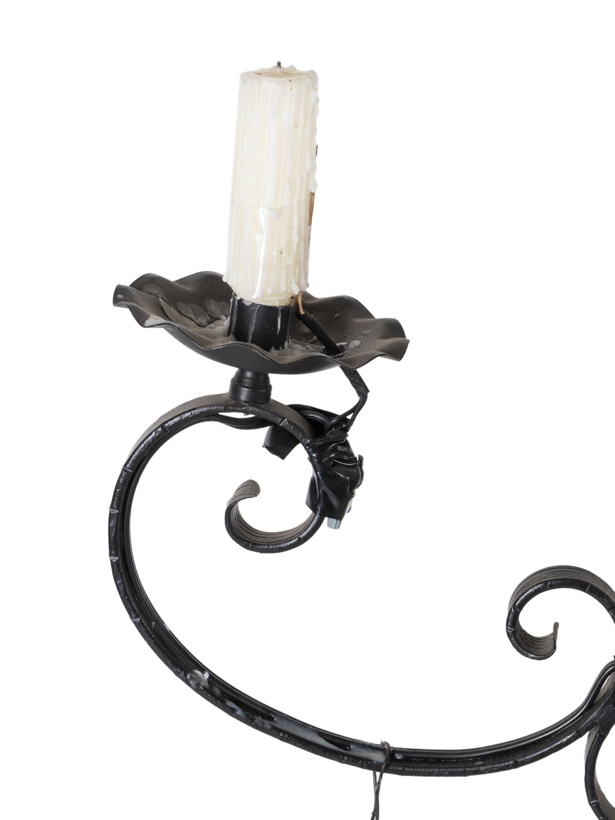 A Black-Painted Wrought Metal Twelve-Light Chandelier