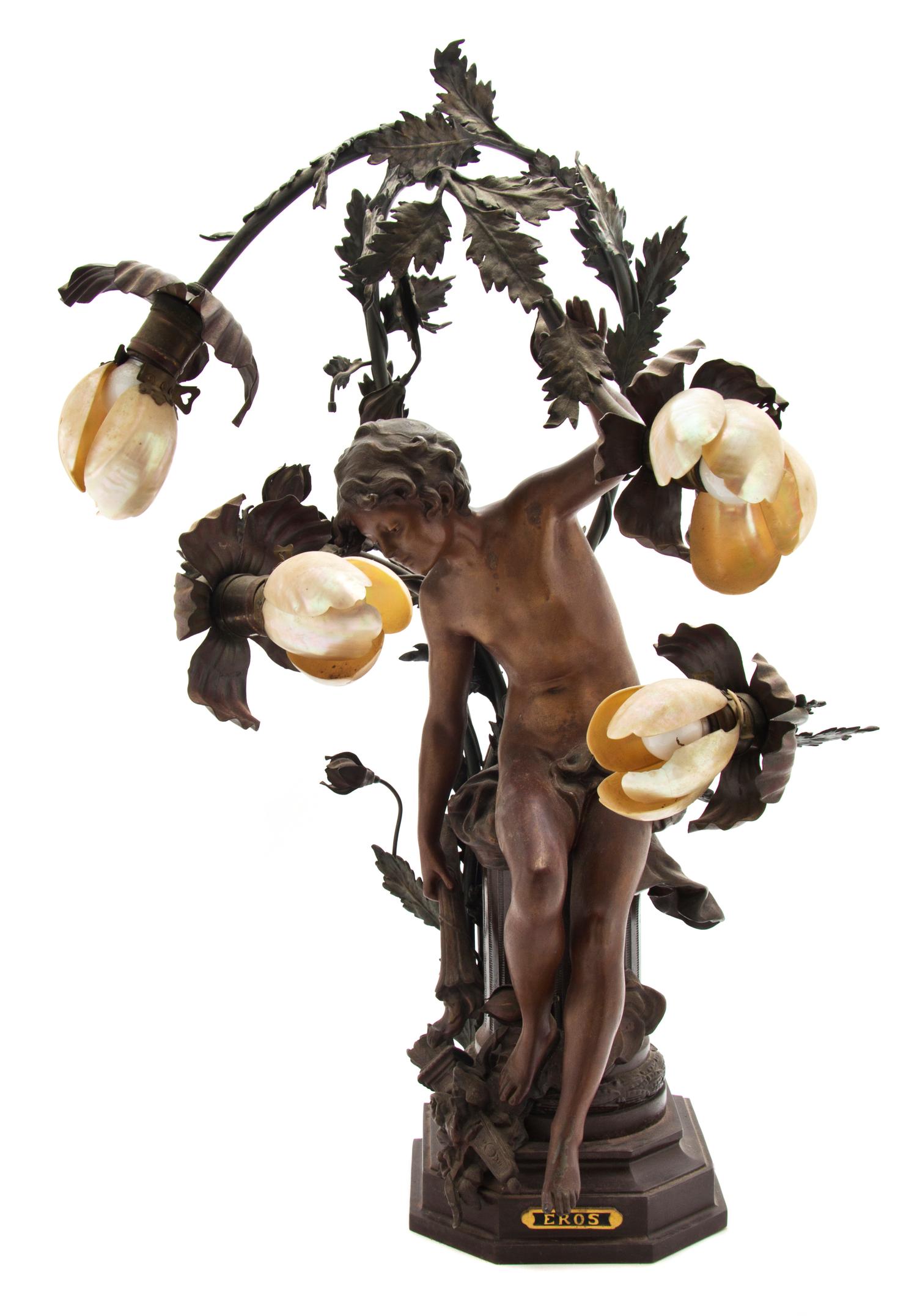 An Art Nouveau Cast Metal Four-Light Figural Newel Lamp, Height 29 inches.