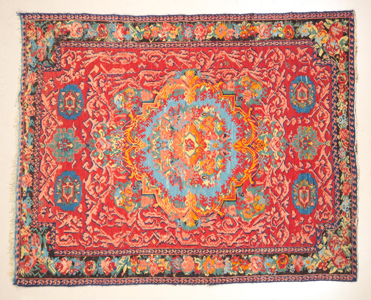 A Wool Rug 6 feet 3 1/2 inches x 5 feet 1 inch.