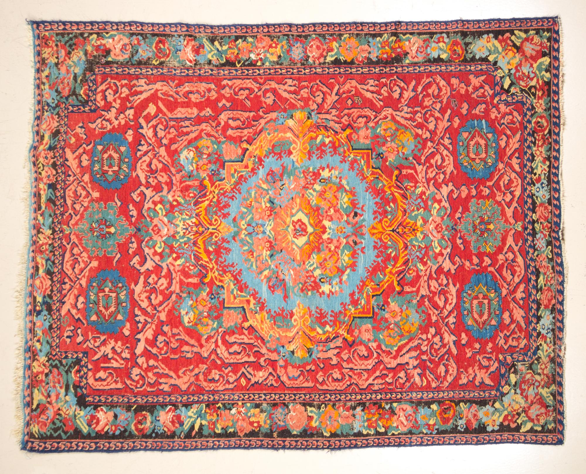 A Wool Rug 6 feet 3 1/2 inches x 5 feet 1 inch.