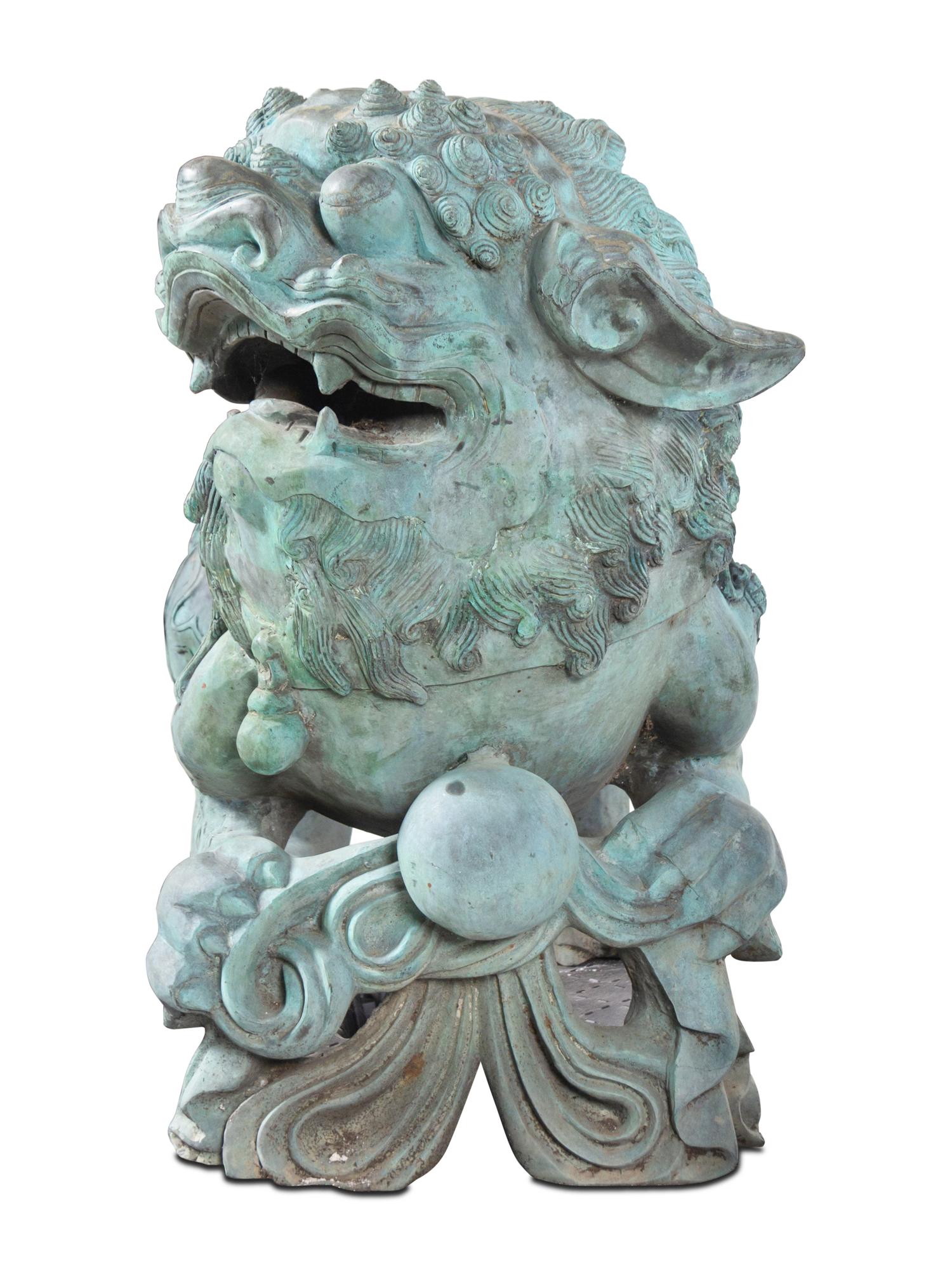 A Pair of Patinated Bronze Buddhistic Lions