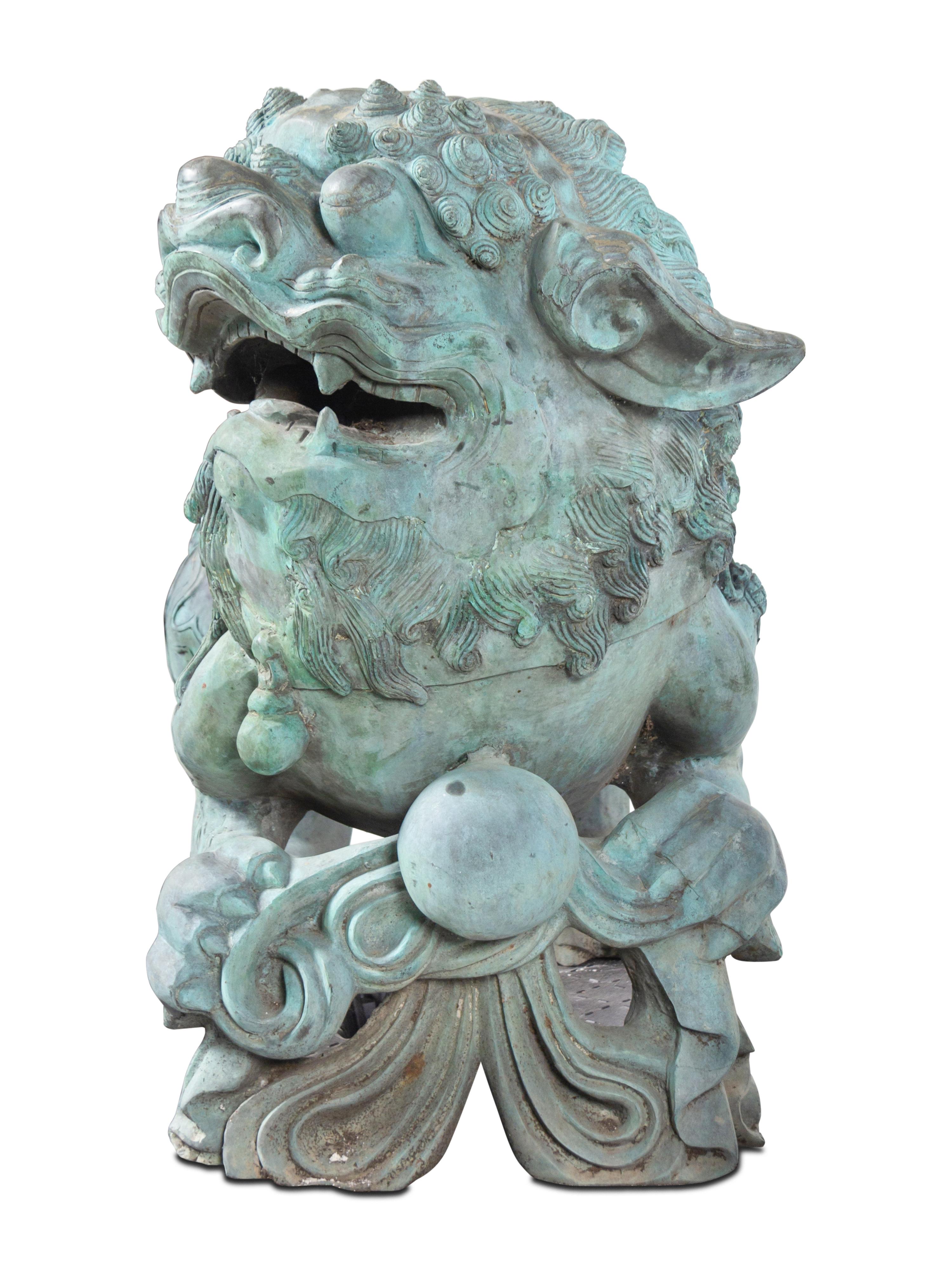 A Pair of Patinated Bronze Buddhistic Lions