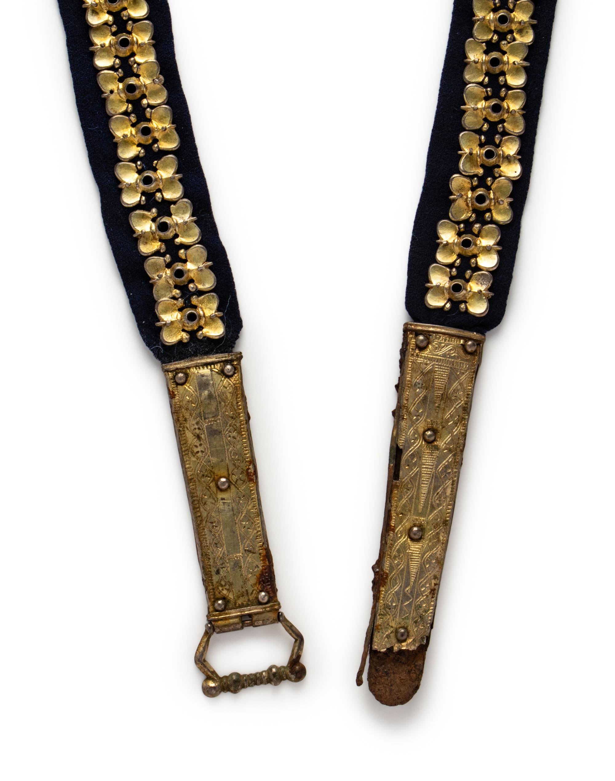 A Carolingian Gilt-Silver Belt with Buckle, Clasp, and 62 Fittings