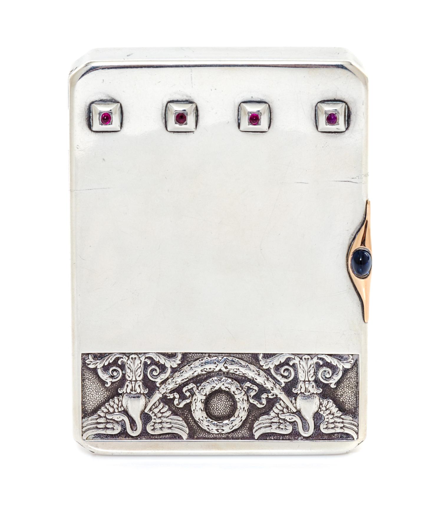 A Russian Ruby and Sapphire Inset Silver Cigarette Case, Mark of Faberge with Imperial warrant, Moscow, 20th century, the lid worked to