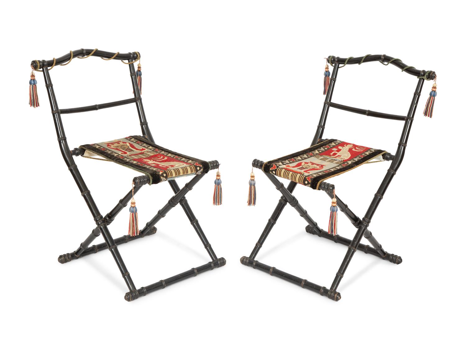 A Pair of Napoleon III Ebonized Folding Chairs with Needlepoint Seats