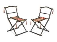 A Pair of Napoleon III Ebonized Folding Chairs with Needlepoint Seats