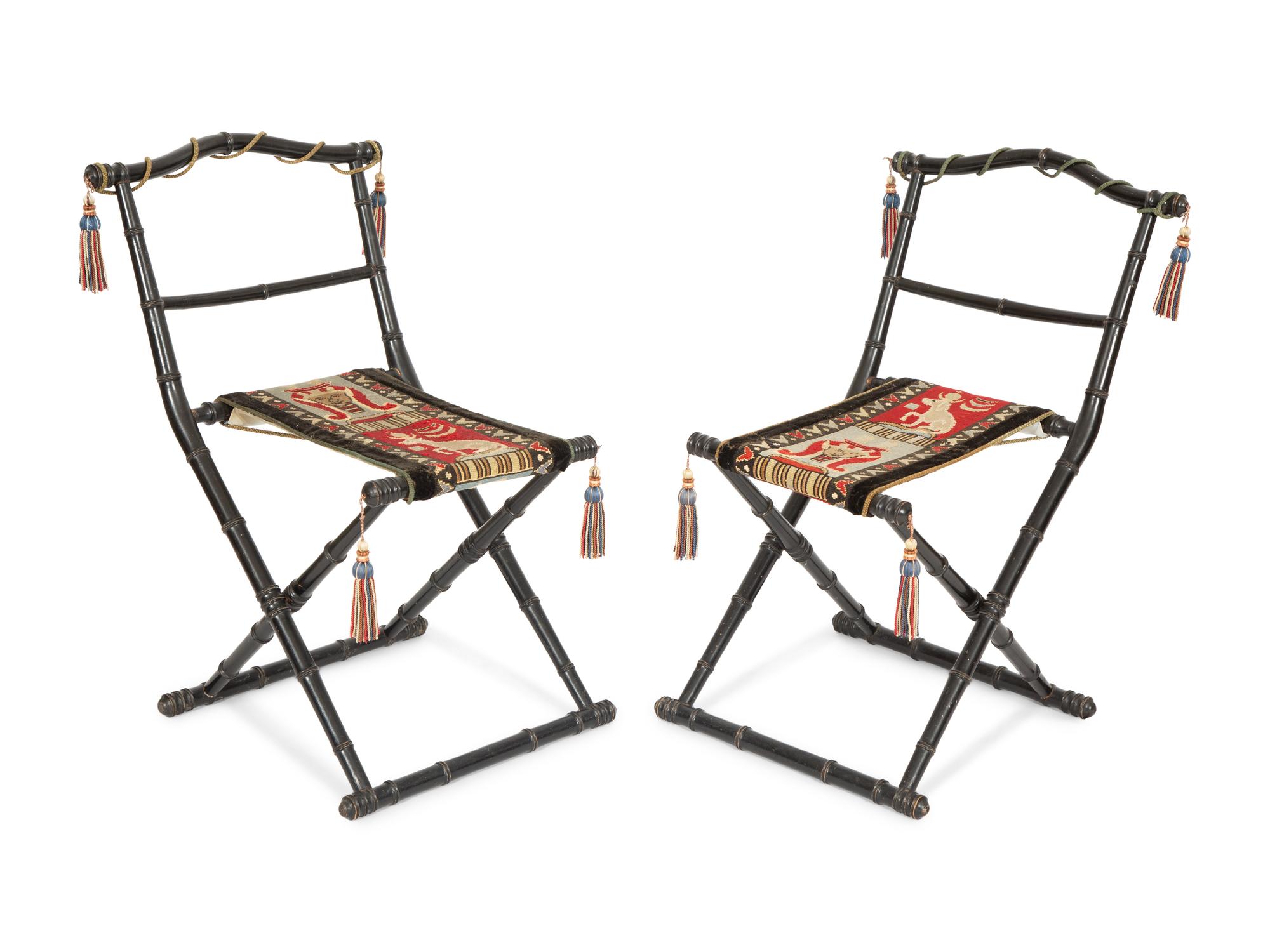 A Pair of Napoleon III Ebonized Folding Chairs with Needlepoint Seats