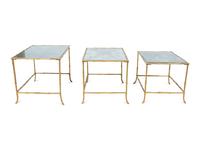 A Set of Three Gilt Metal Mirrored Nesting Tables in the Style of Maison Bagues