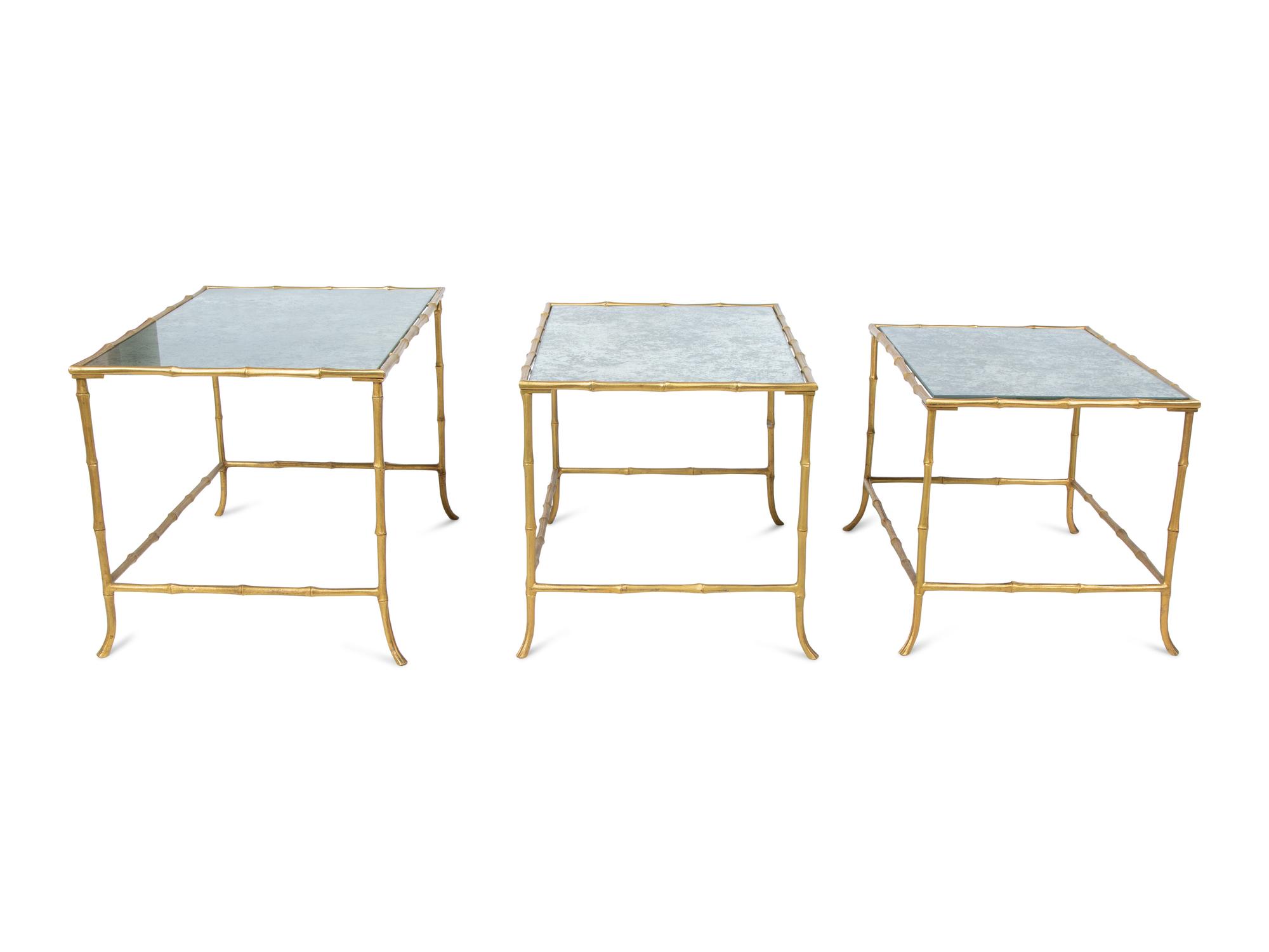 A Set of Three Gilt Metal Mirrored Nesting Tables in the Style of Maison Bagues