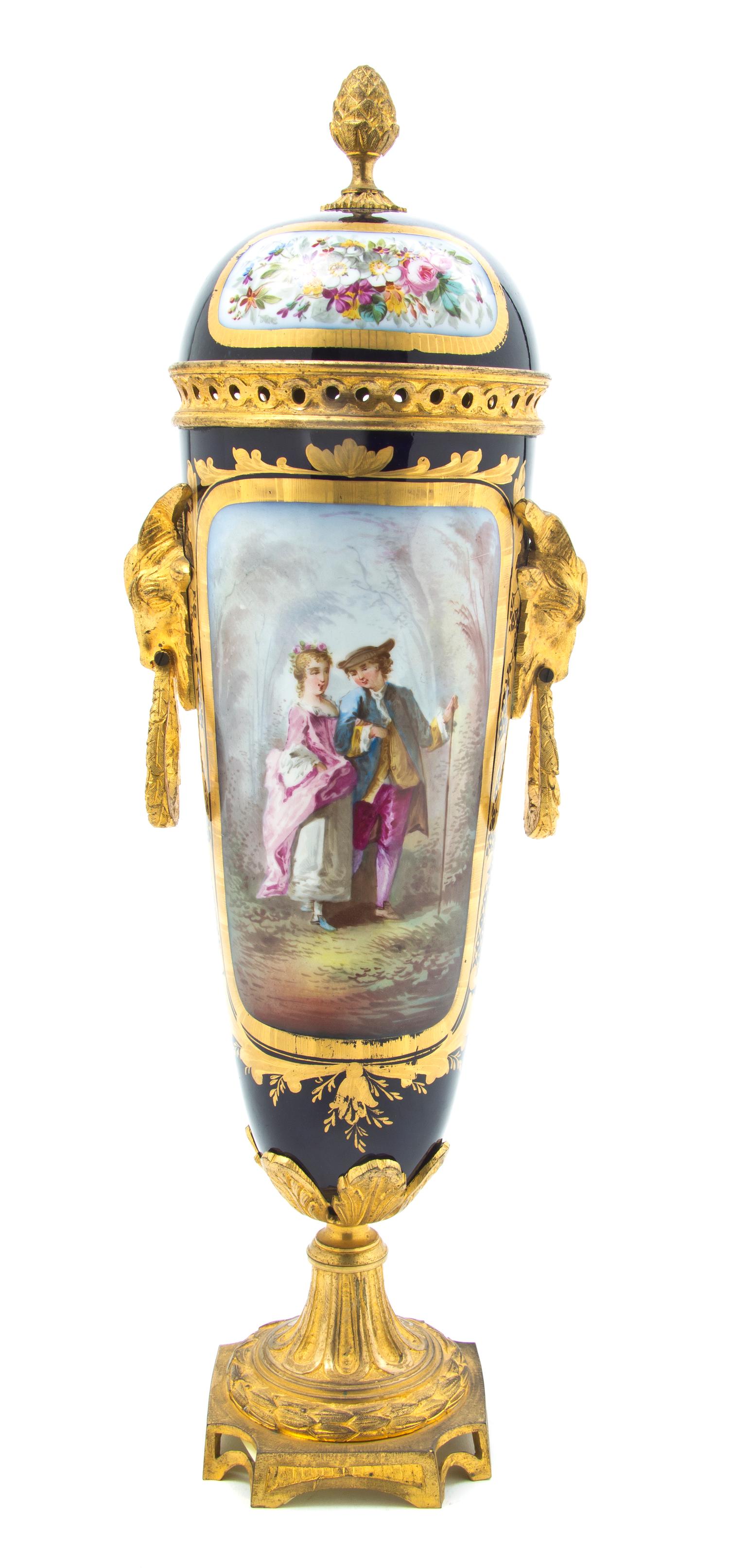A Sevres Style Porcelain and Gilt Metal Mounted Covered Urn, Height 17 1/2 inches.