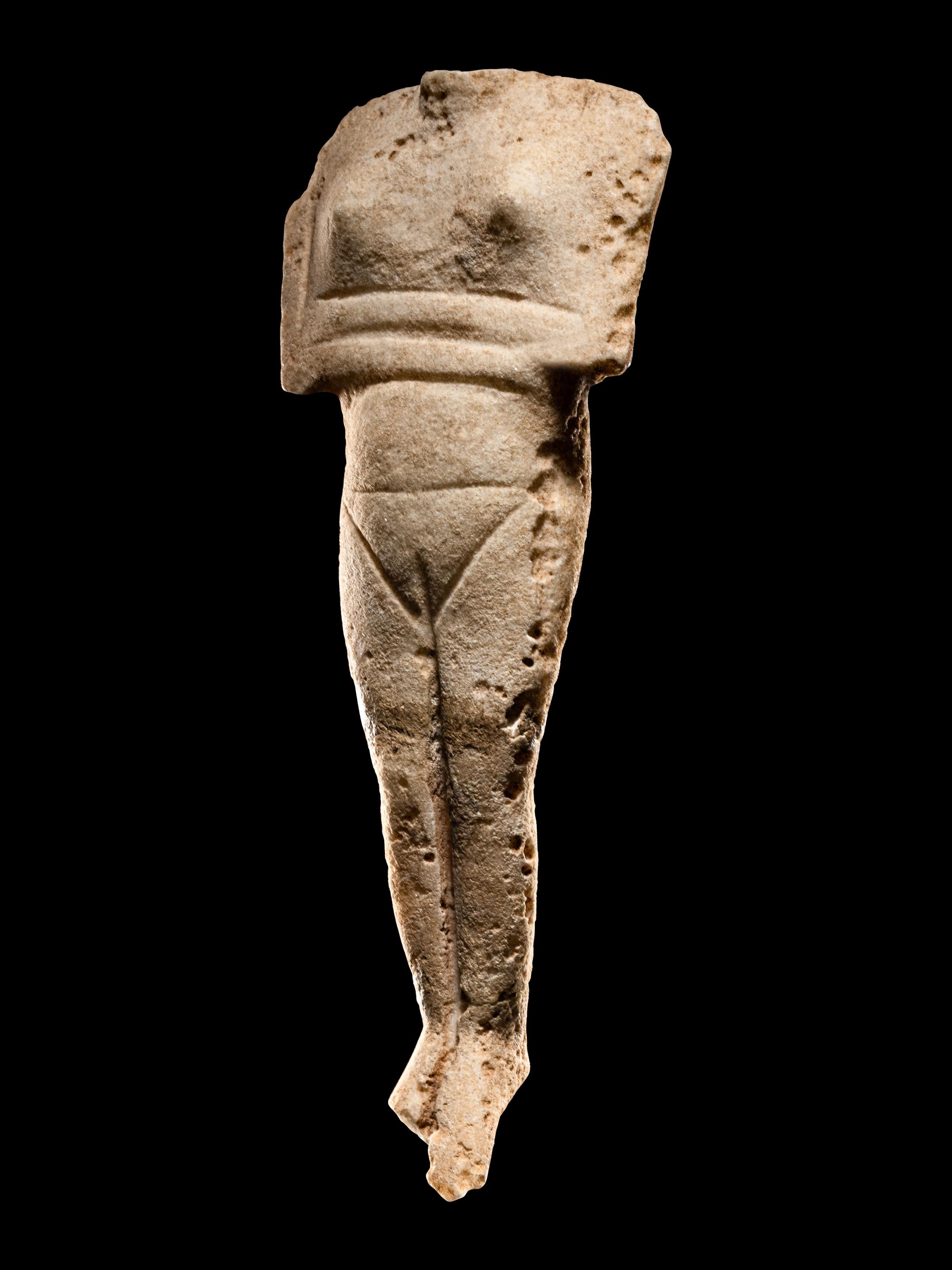 A Cycladic Marble Reclining Female Figure
