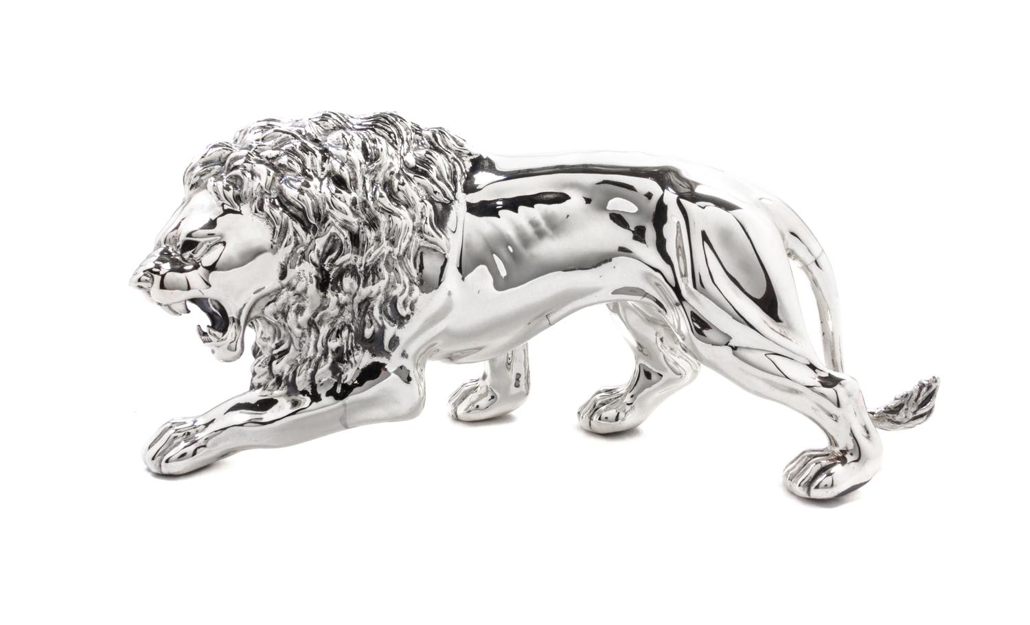 An Italian Silver Table Ornament, 20th Century, in the form of a striding lion.
