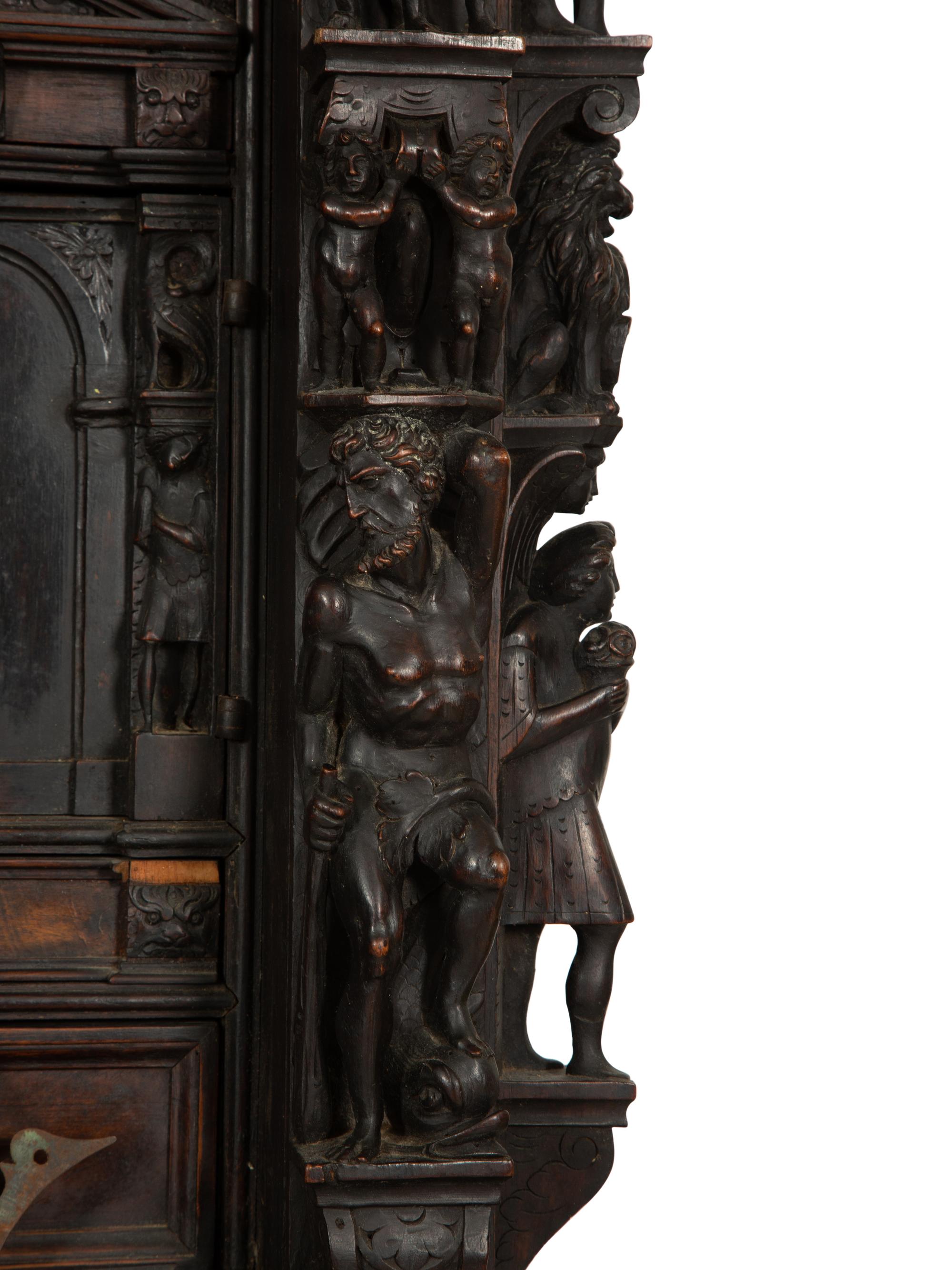 A Continental Baroque Walnut Cabinet