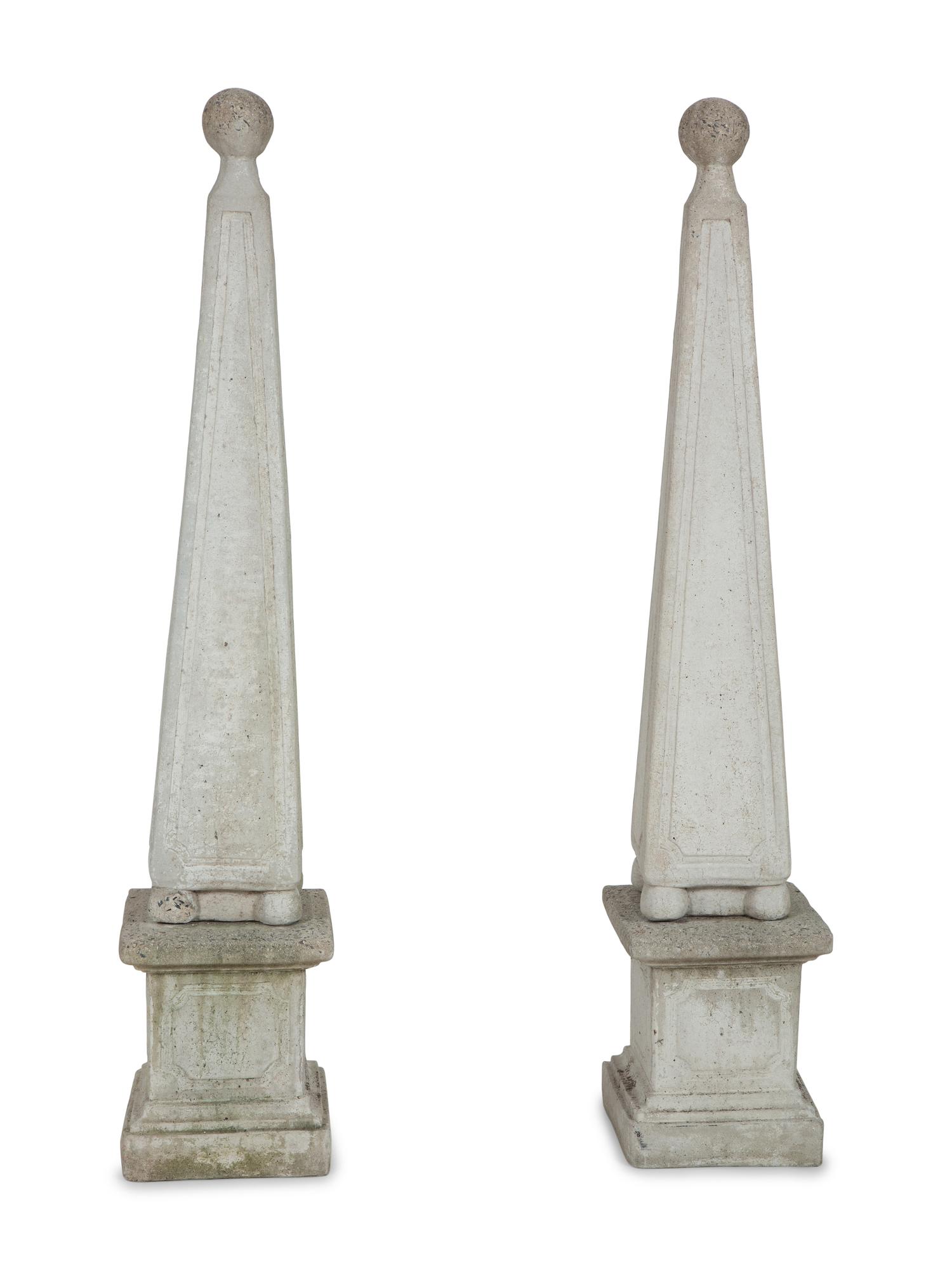A Pair of Cast Stone Obelisks on Bases