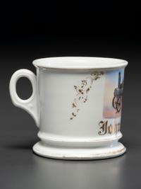 A Porcelain Occupational Shaving Mug Depicting a Steam Tractor