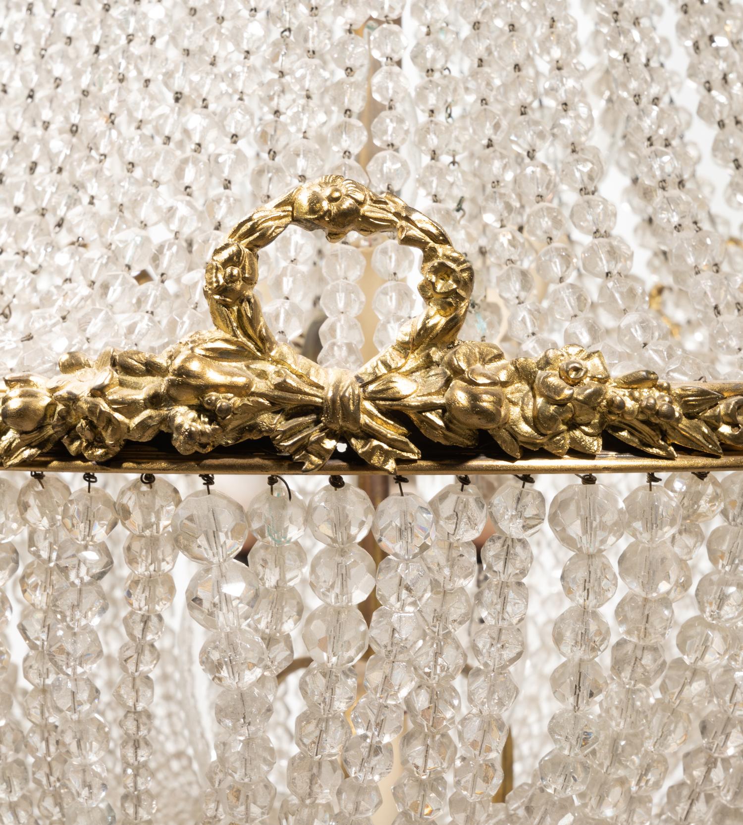An Empire Style Gilt Bronze and Beaded Glass Chandelier