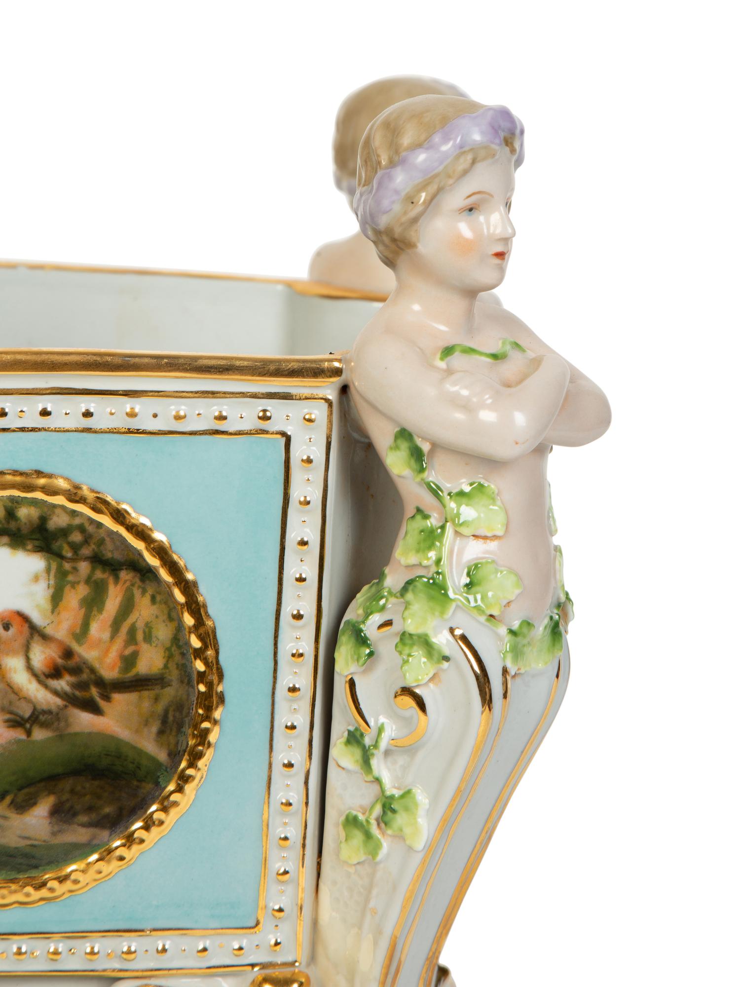 A Continental Porcelain Jardinière and Stand