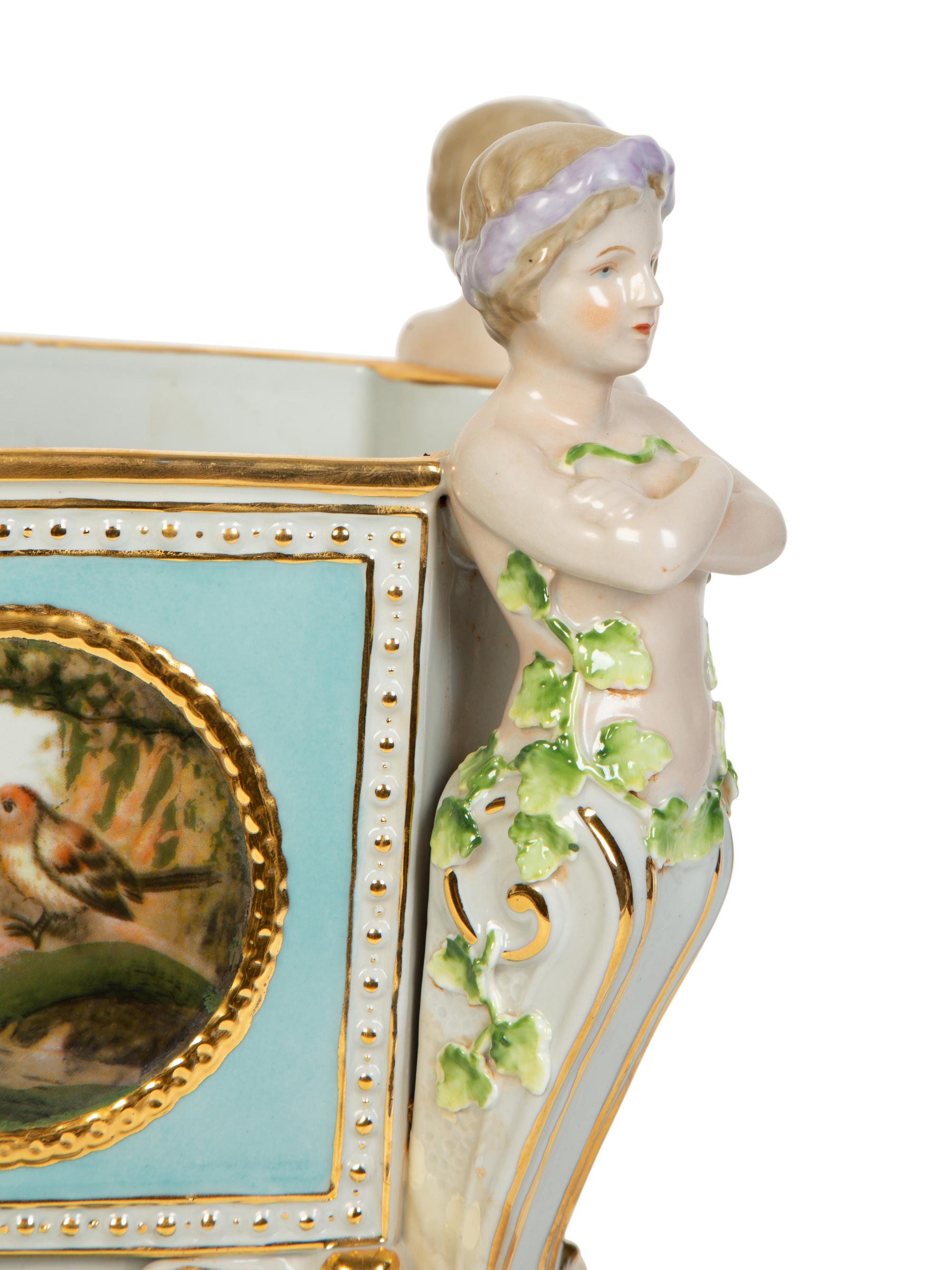 A Continental Porcelain Jardinière and Stand