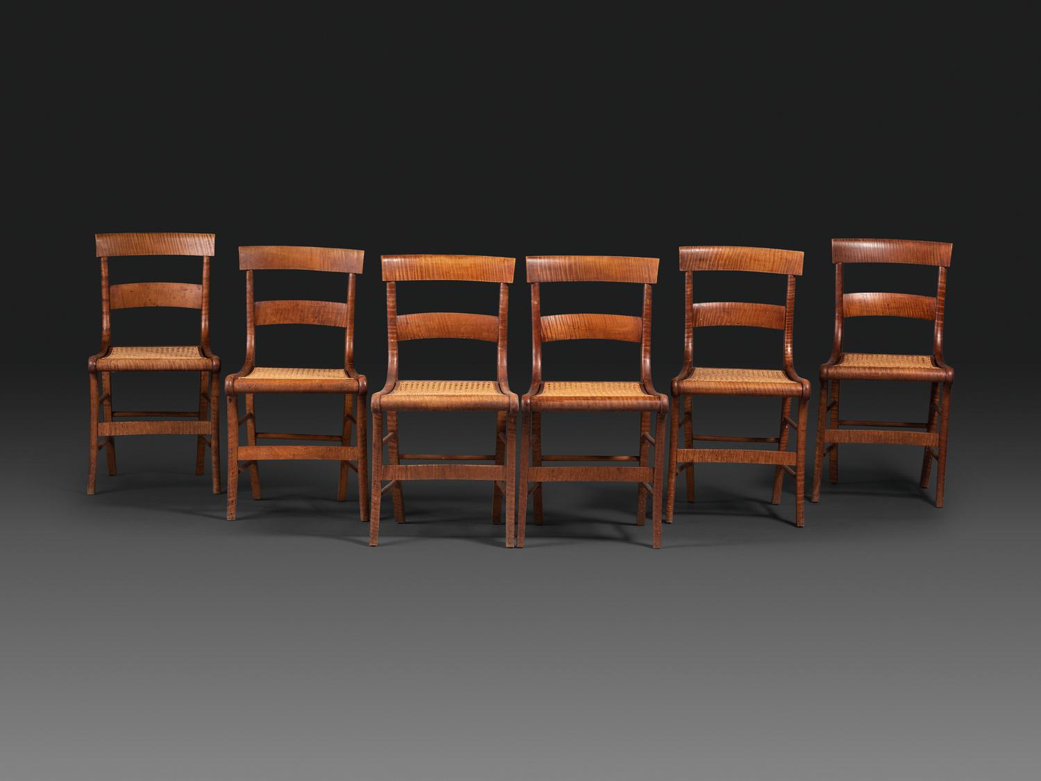 A Set of Six Classical Tiger Maple Cane-Seat Dining Chairs