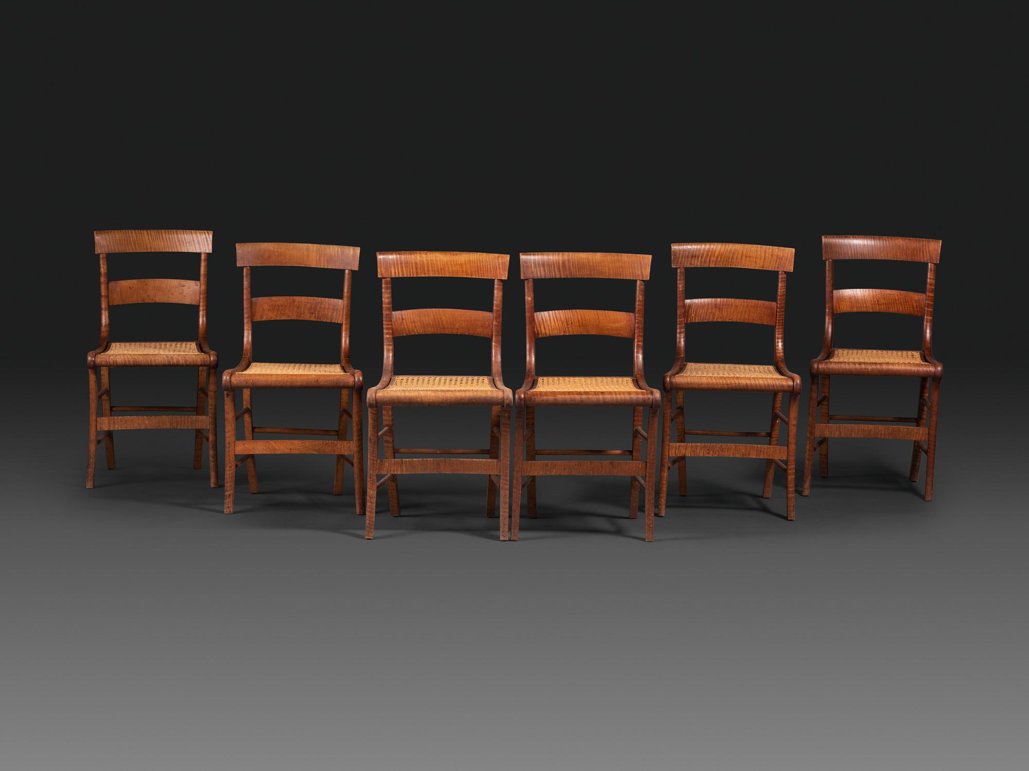 A Set of Six Classical Tiger Maple Cane-Seat Dining Chairs