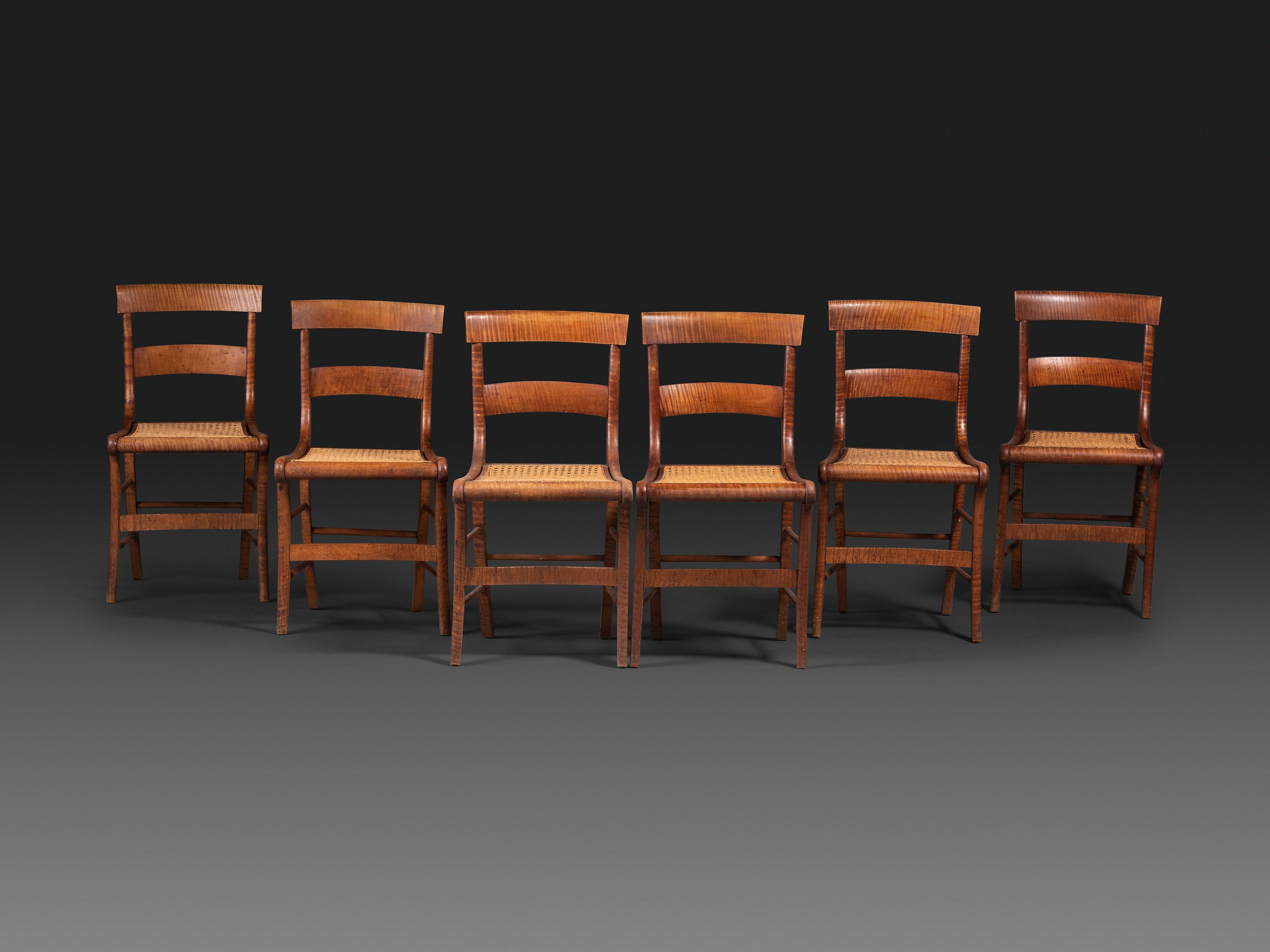A Set of Six Classical Tiger Maple Cane-Seat Dining Chairs