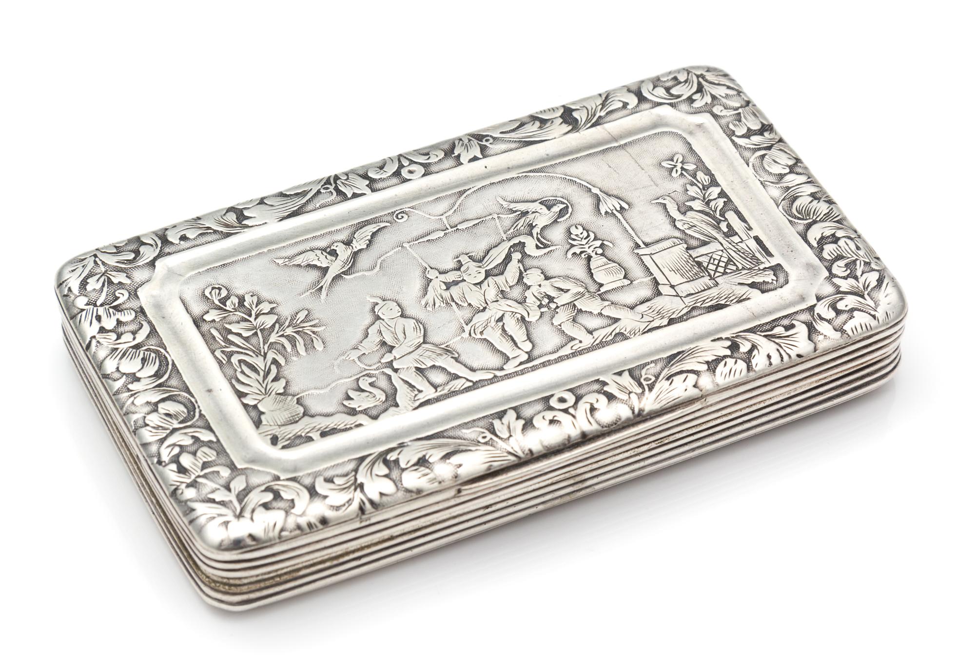 A French Silver Cigarette Case, , the lid having a foliate border and worked to show an Orientalist garden scene.