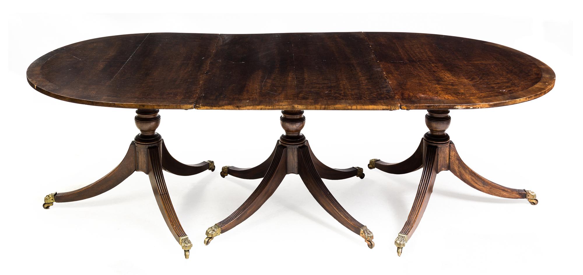 A George III Mahogany Triple Pedestal Dining Table Height 27 1/2 x width 107 x depth 45 inches. — EARLY 19TH CENTURY