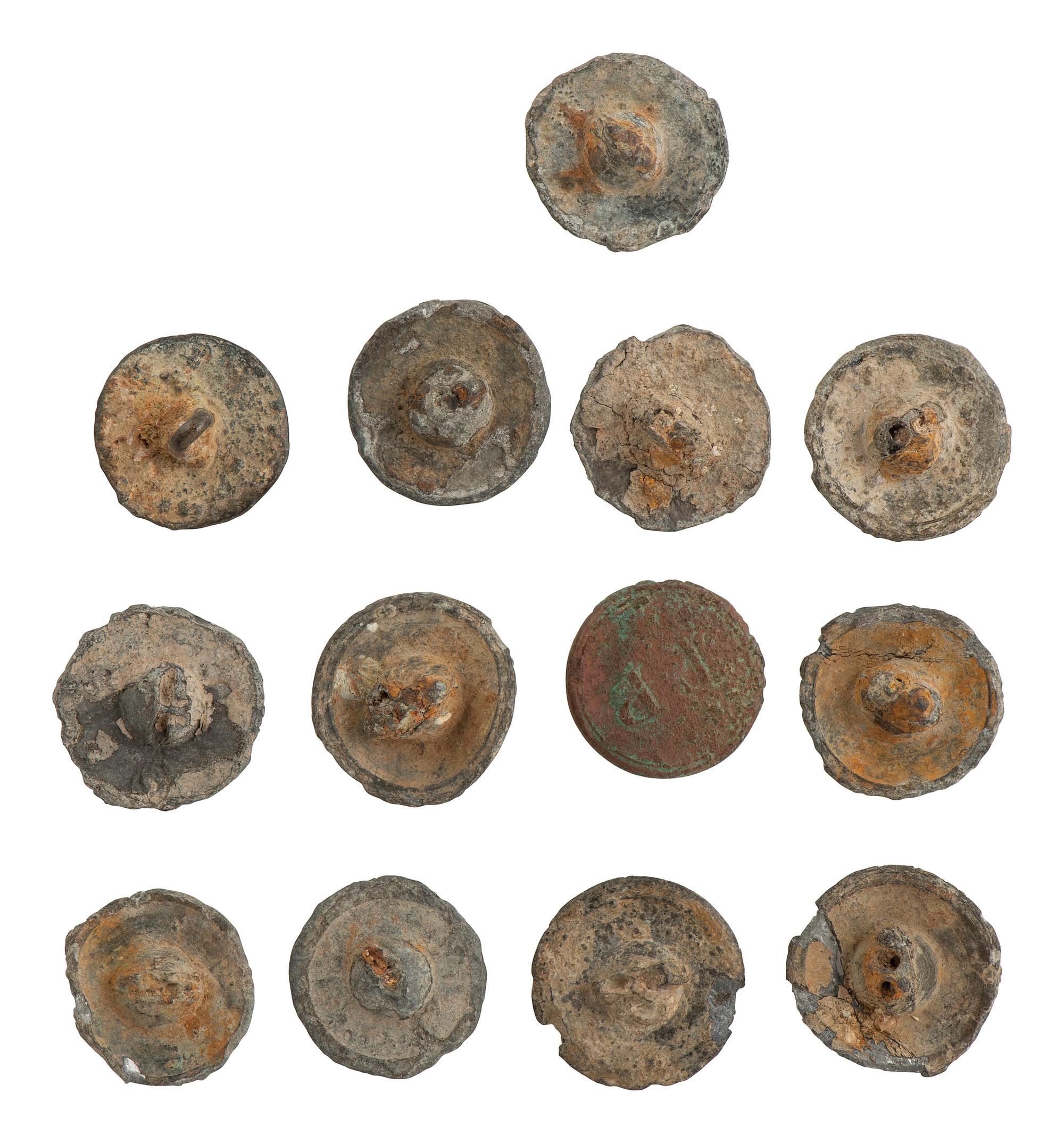 [AFRICAN AMERICANA] 13 excavated buttons, some identified to auctioneer and slave trader T. Porter.