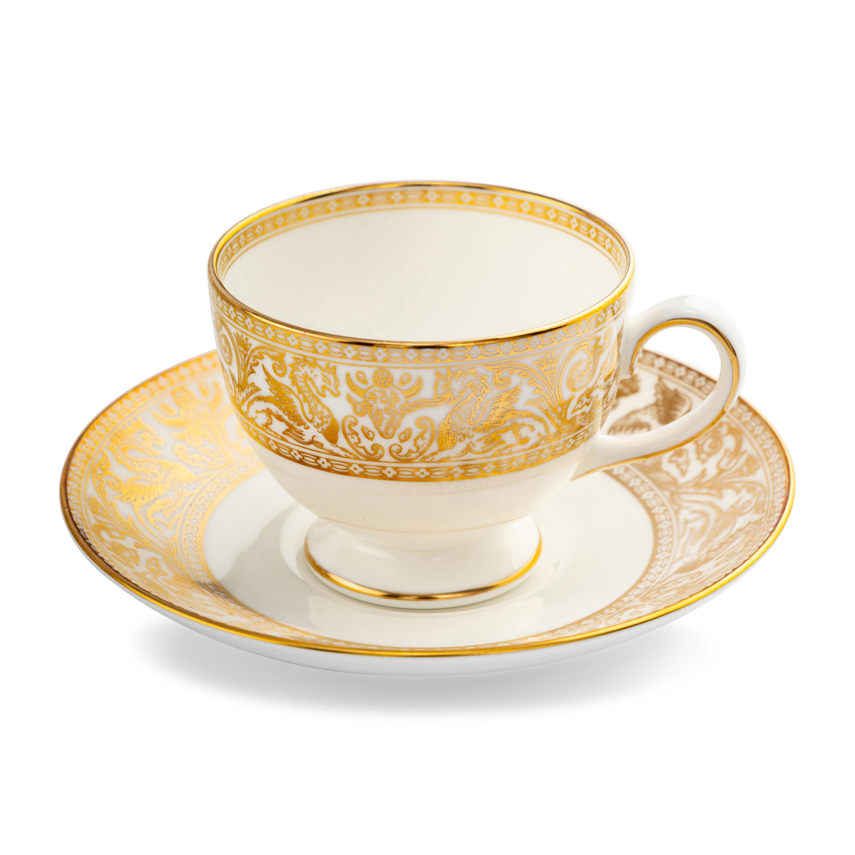 A Wedgwood Gold Florentine Porcelain Dinner Service