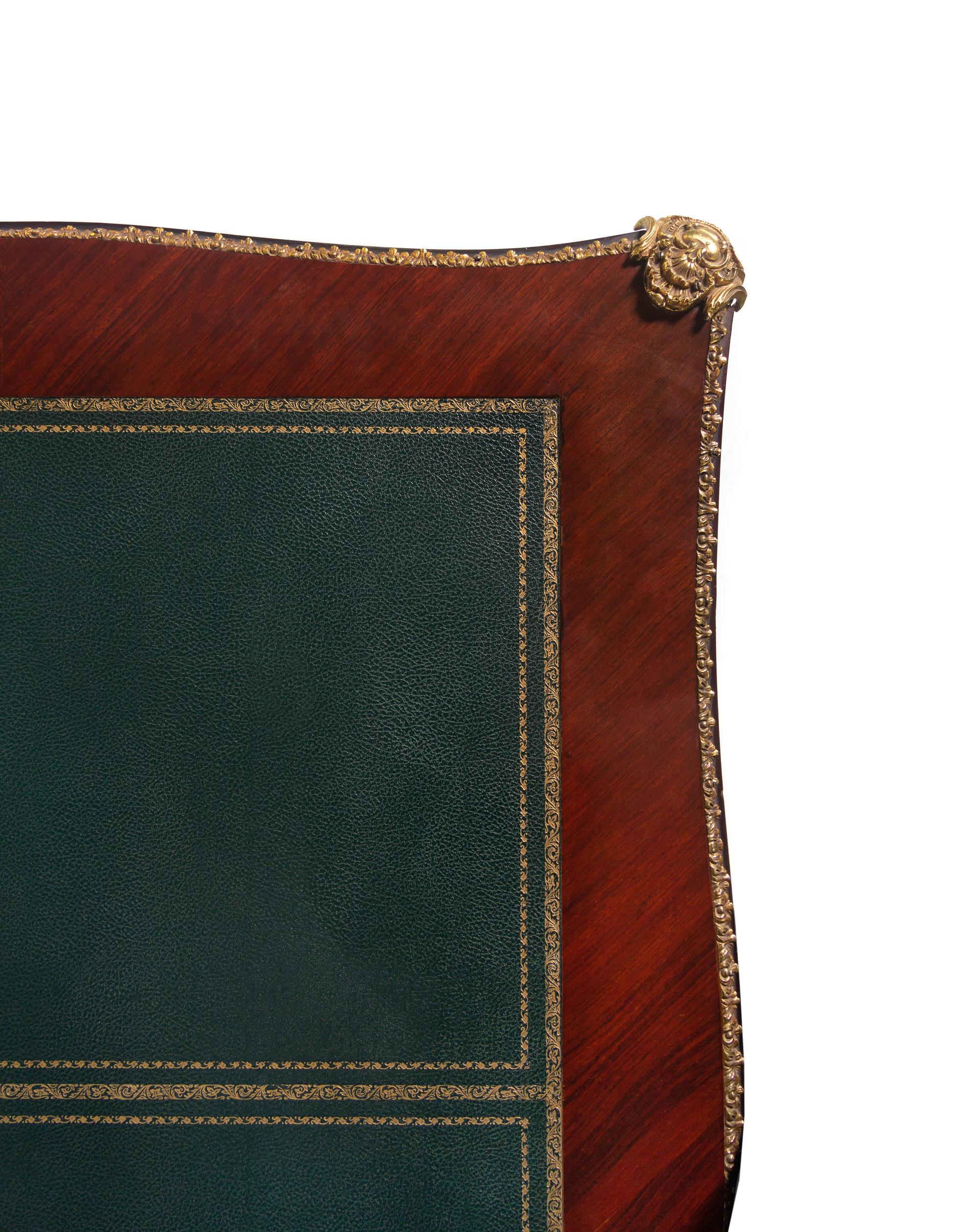 A Louis XV Style Gilt Bronze Mounted Mahogany Veneered Bureau Plat