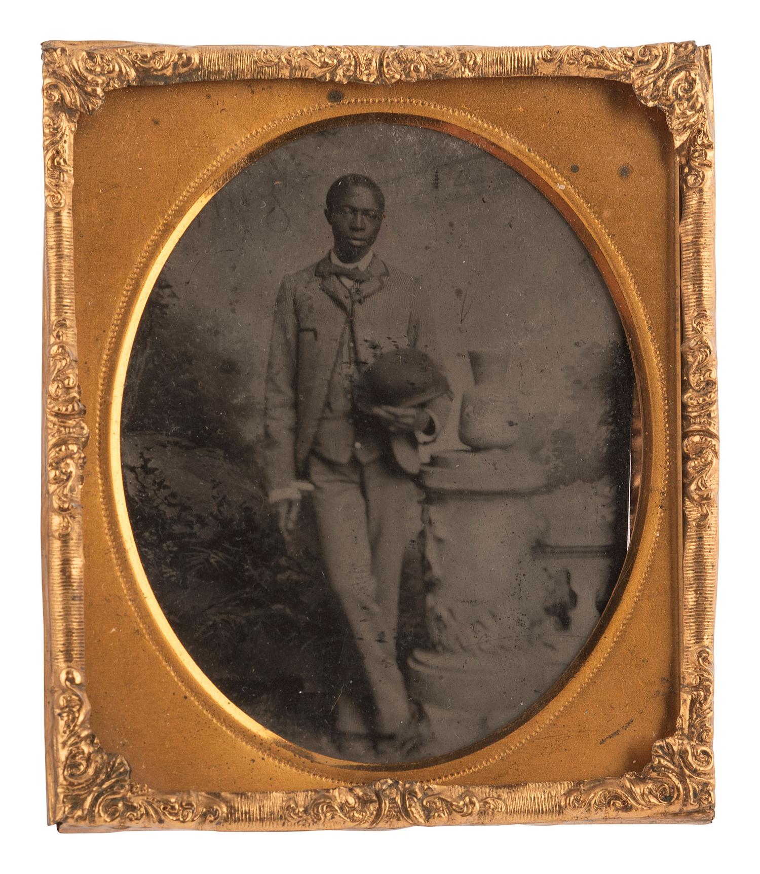 [EARLY PHOTOGRAPHY]. 6 photos of African American subjects, incl. sixth plate tintype of young man.
