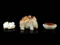 Three Jade Celadon and Russet Figures