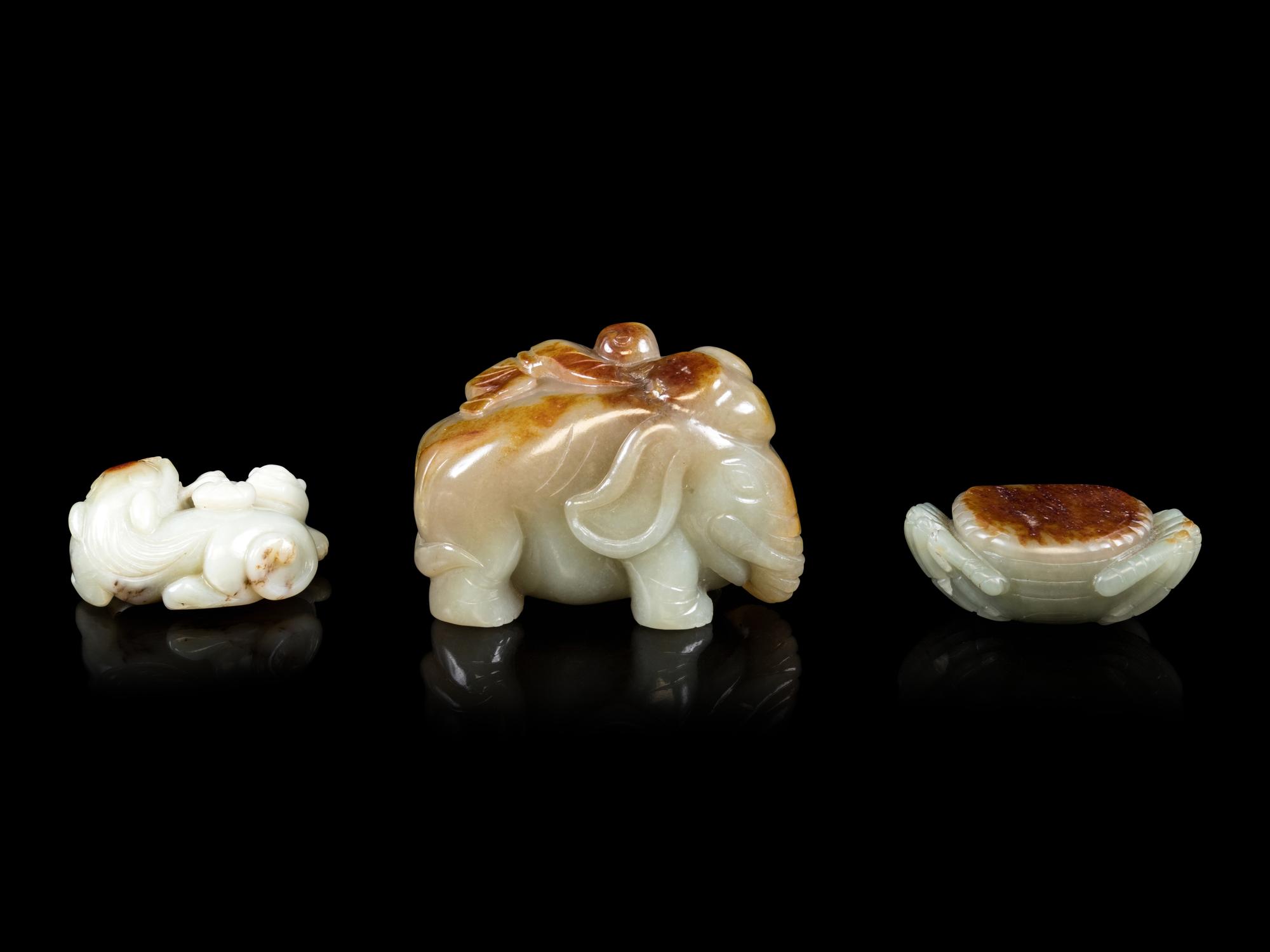 Three Jade Celadon and Russet Figures