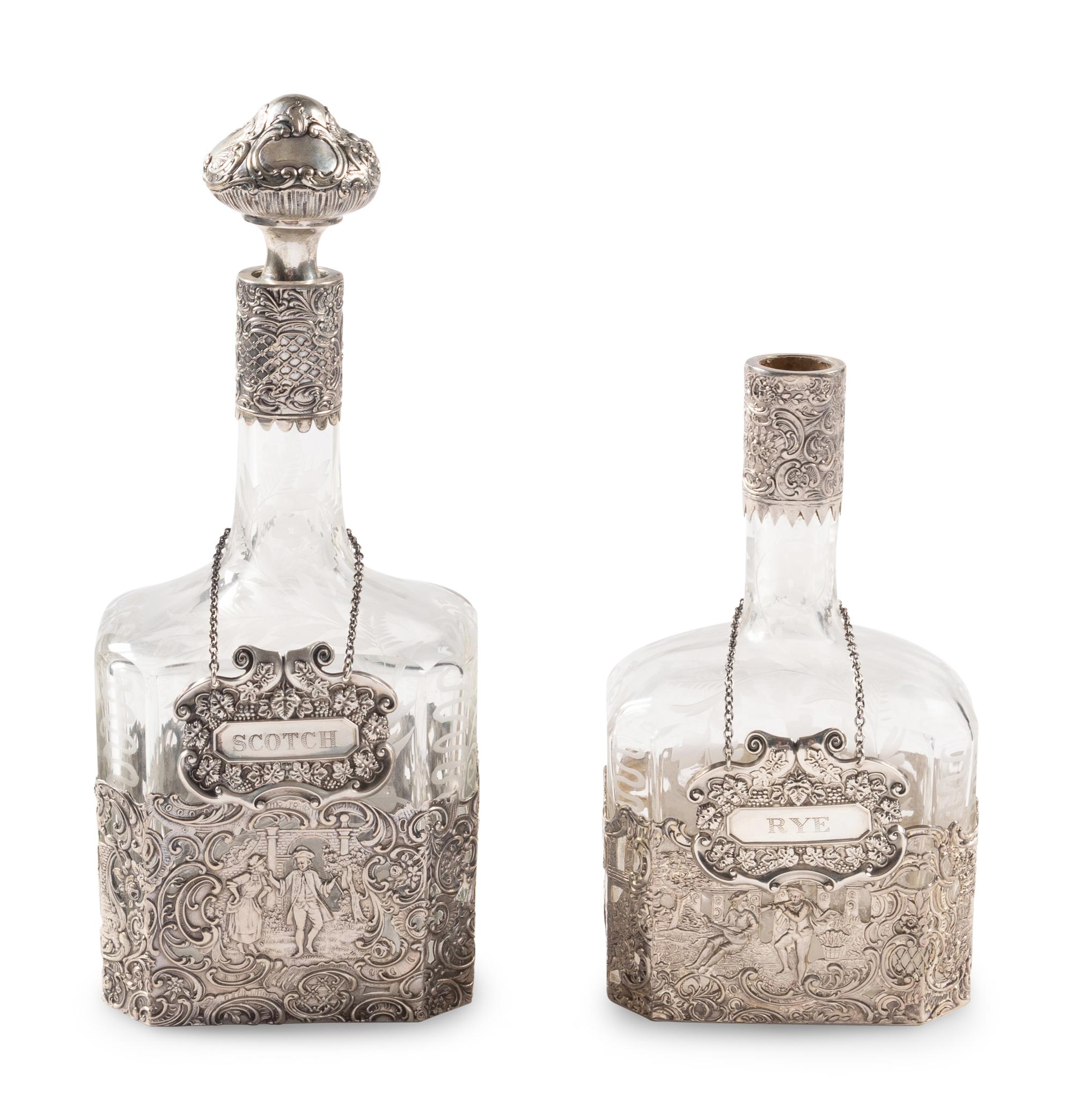 Two Silver Mounted Etched Glass Decanters