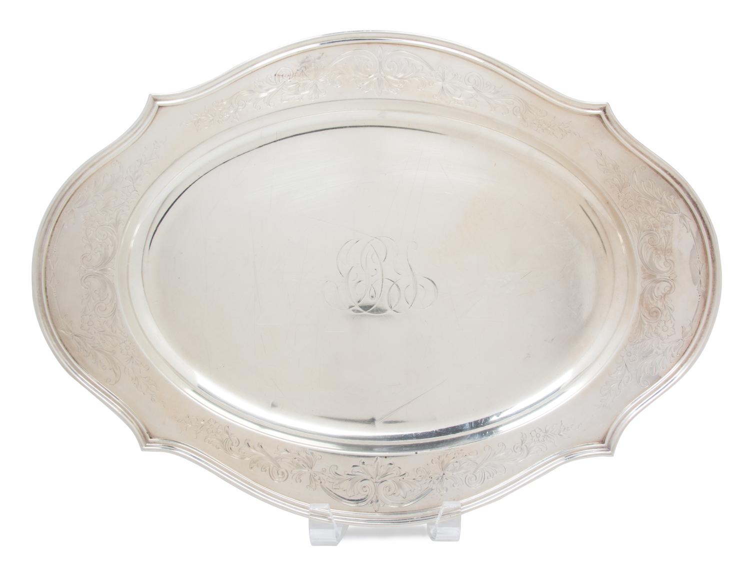 An American Silver Oval Tray, Reed & Barton, Taunton, MA, having a shaped floral and foliate etched border, monogrammed.