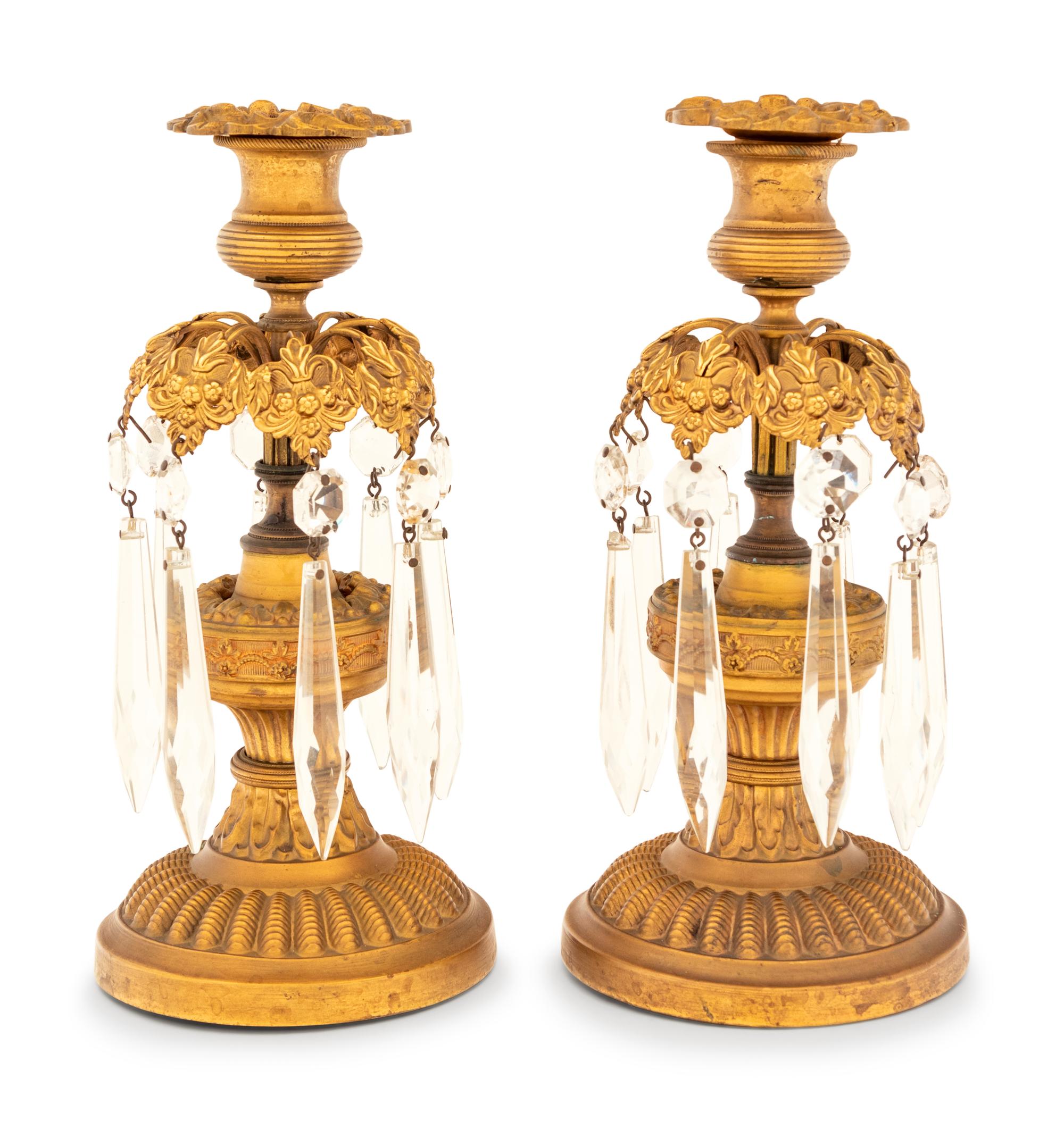 A Pair of Gilt Metal and Glass Candlesticks