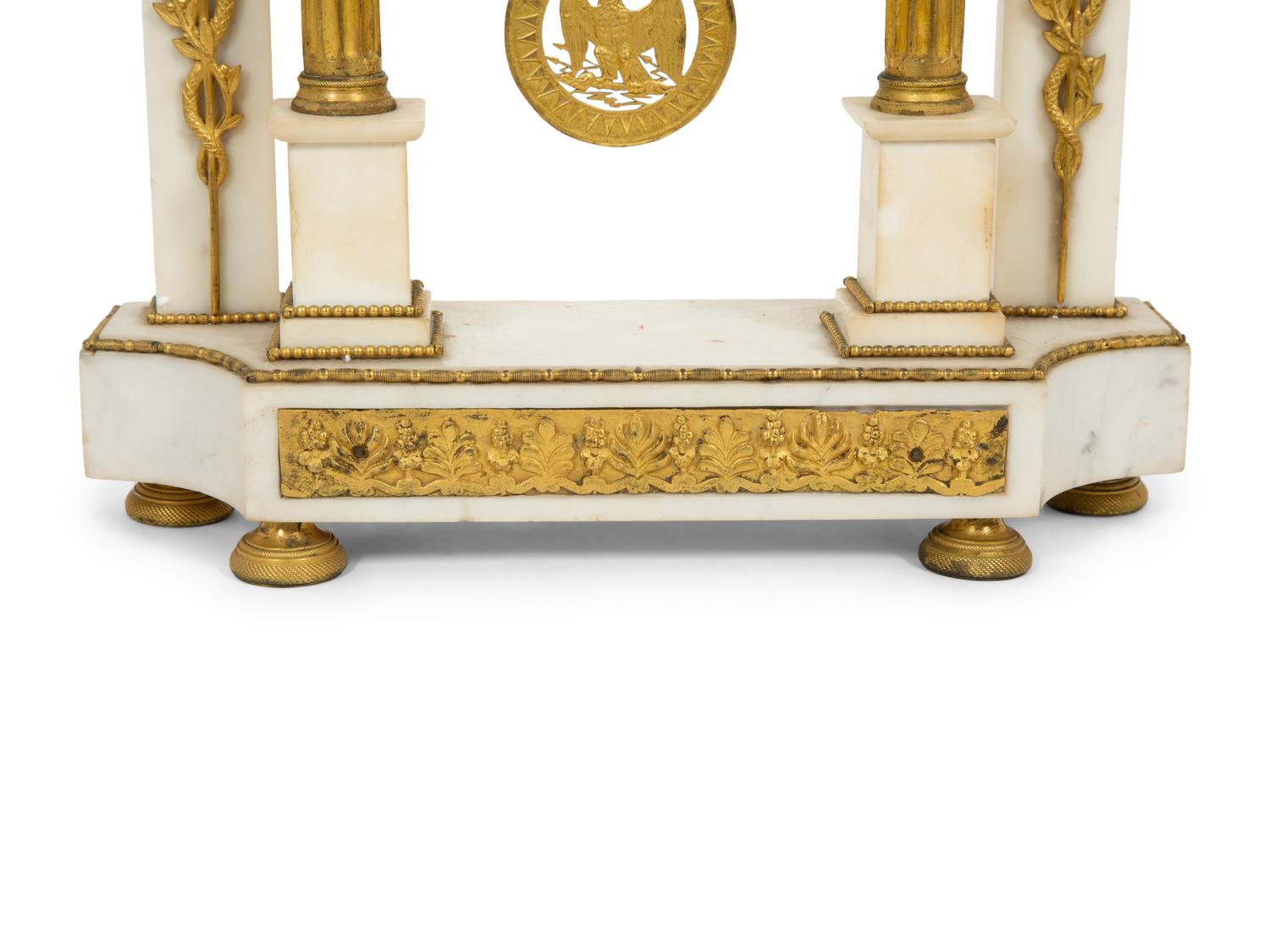 A French Gilt Bronze and White Marble Mantel Clock