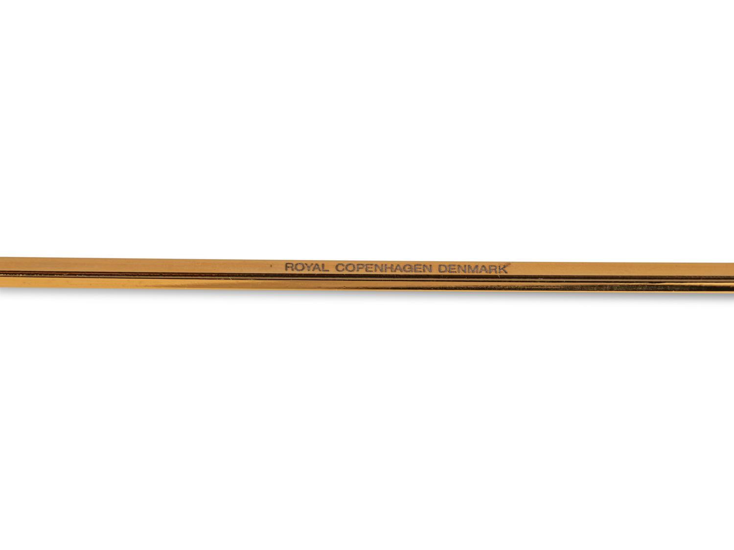 An Andreas Mikkelsen Designed Georg Jensen Gilt-Metal Candle Snuffer