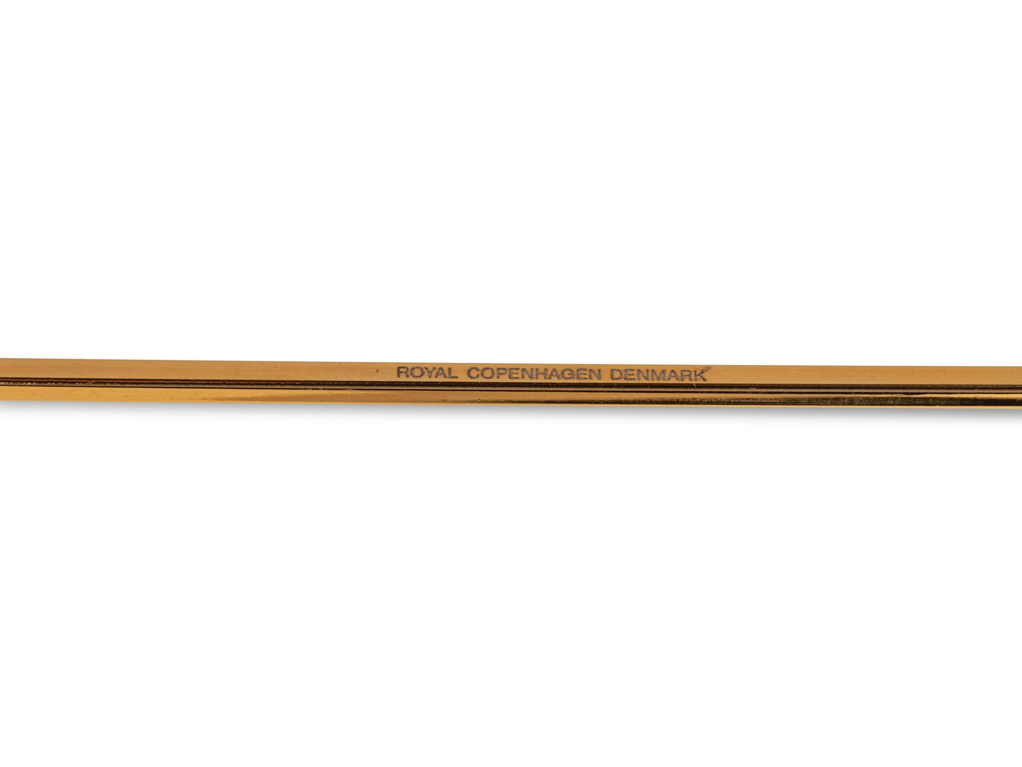 An Andreas Mikkelsen Designed Georg Jensen Gilt-Metal Candle Snuffer
